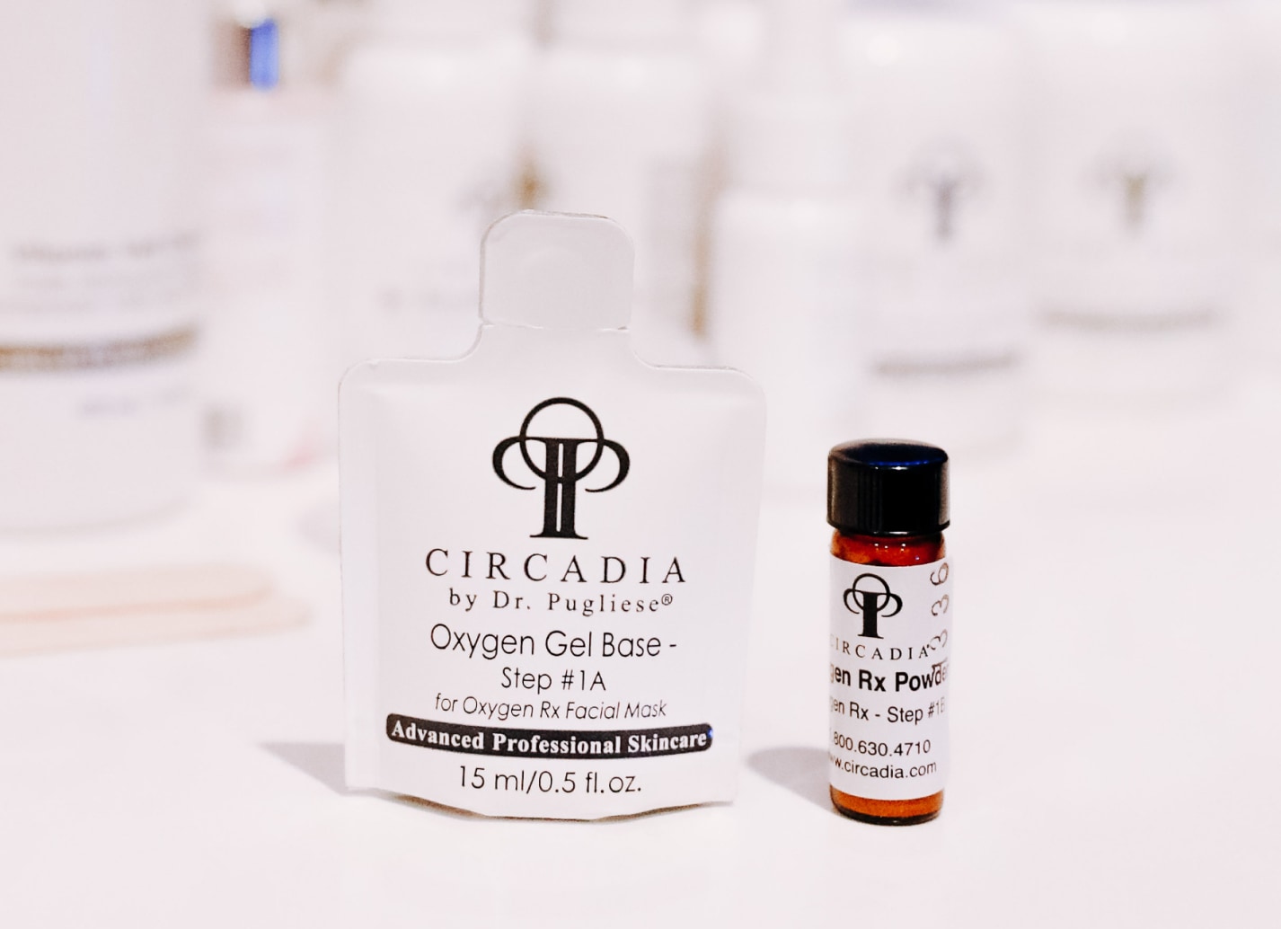 Oxygen facial products on table, used for acne facials.