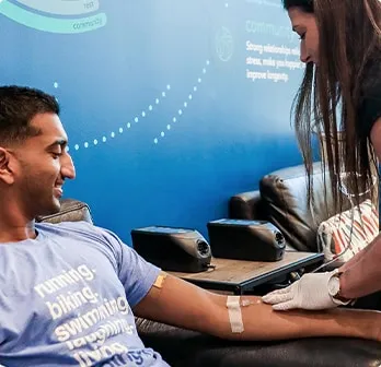 Smiling man receiving iv drip therapy near me in Austin.