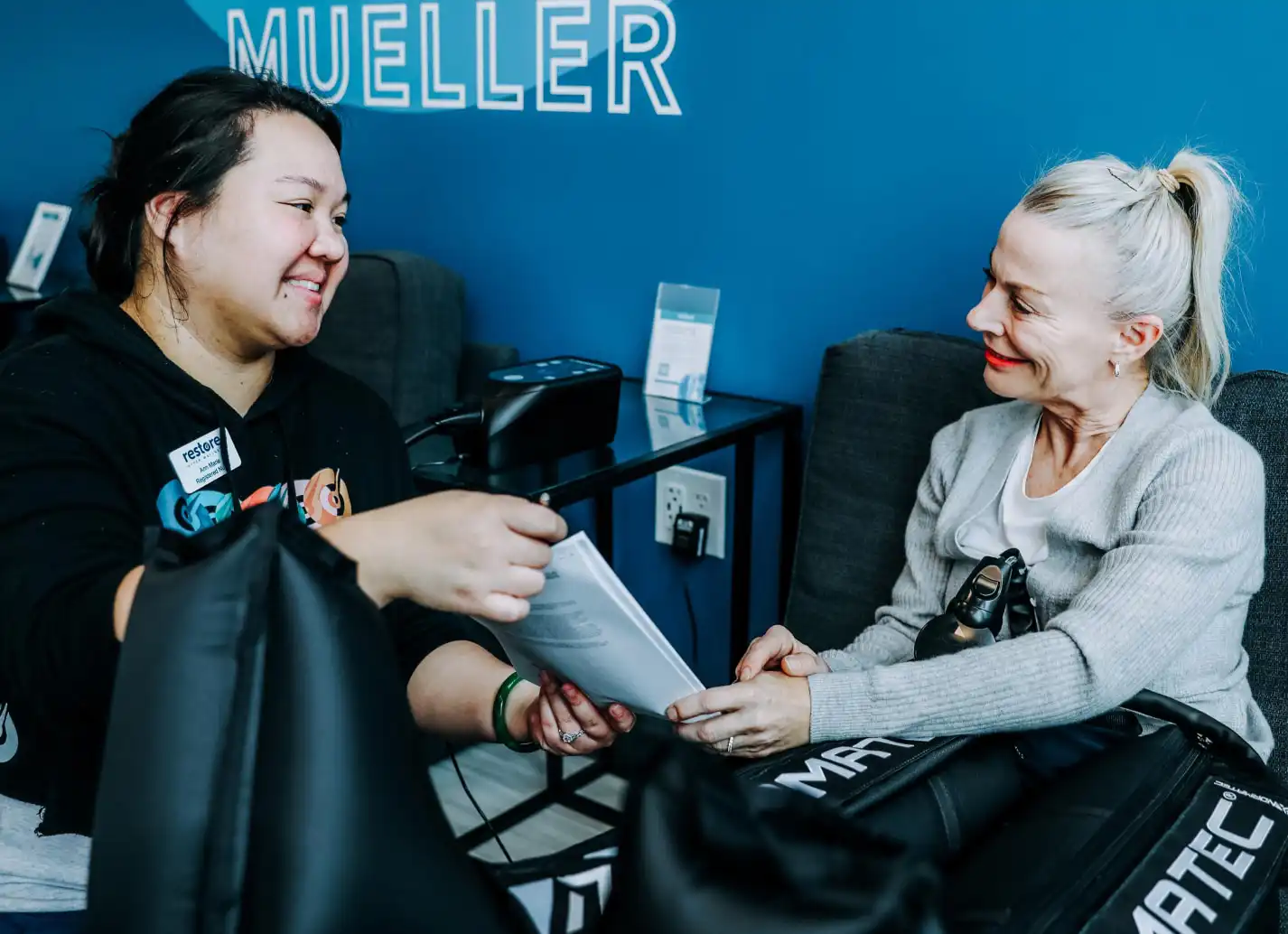 Nurse explaining biomarker assessments to customer.