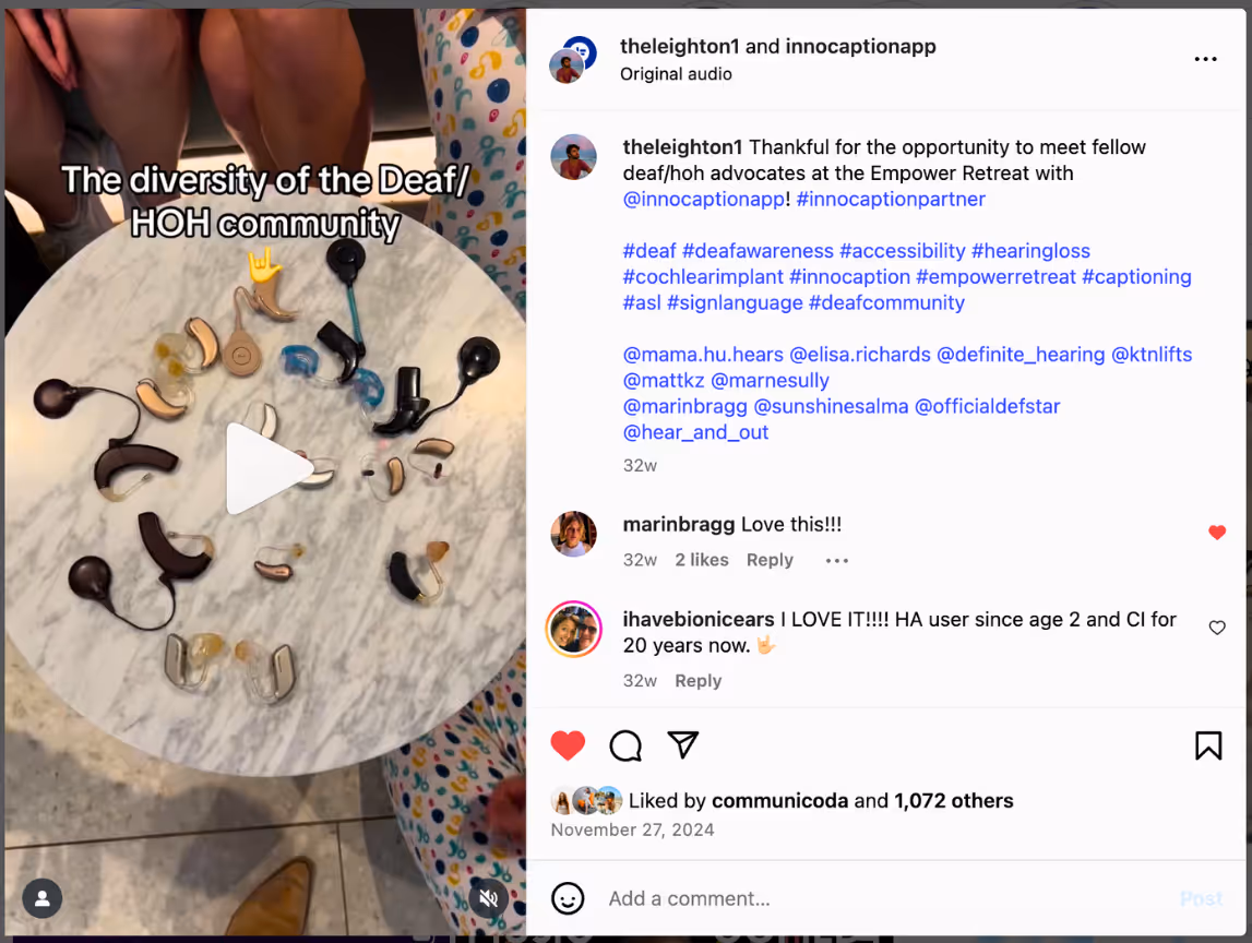 An Instagram post featuring a video still showing a round table with a variety of hearing devices arranged in a circle — including hearing aids and cochlear implant processors — representing the diversity of the Deaf and hard of hearing community. Caption text reads “The diversity of the Deaf/HOH community” with a yellow ILY (I love you) hand sign emoji. The Instagram caption thanks InnoCaption and mentions various deaf/hoh advocates and hashtags promoting deaf awareness and accessibility.