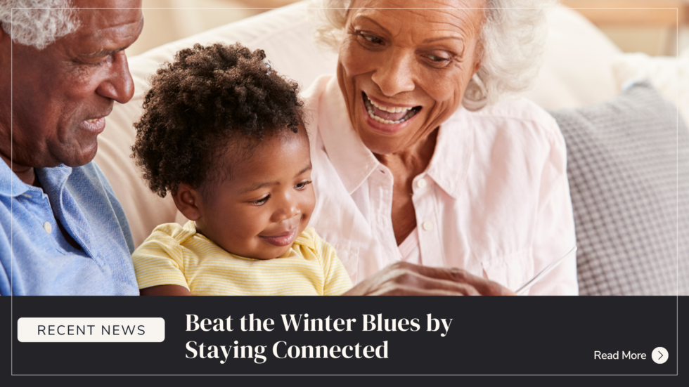 A promotional banner featuring an older Black man and woman smiling warmly at a young toddler sitting between them. Graphic text overlay at the bottom reads: "RECENT NEWS. Beat the Winter Blues by Staying Connected. Read More."
