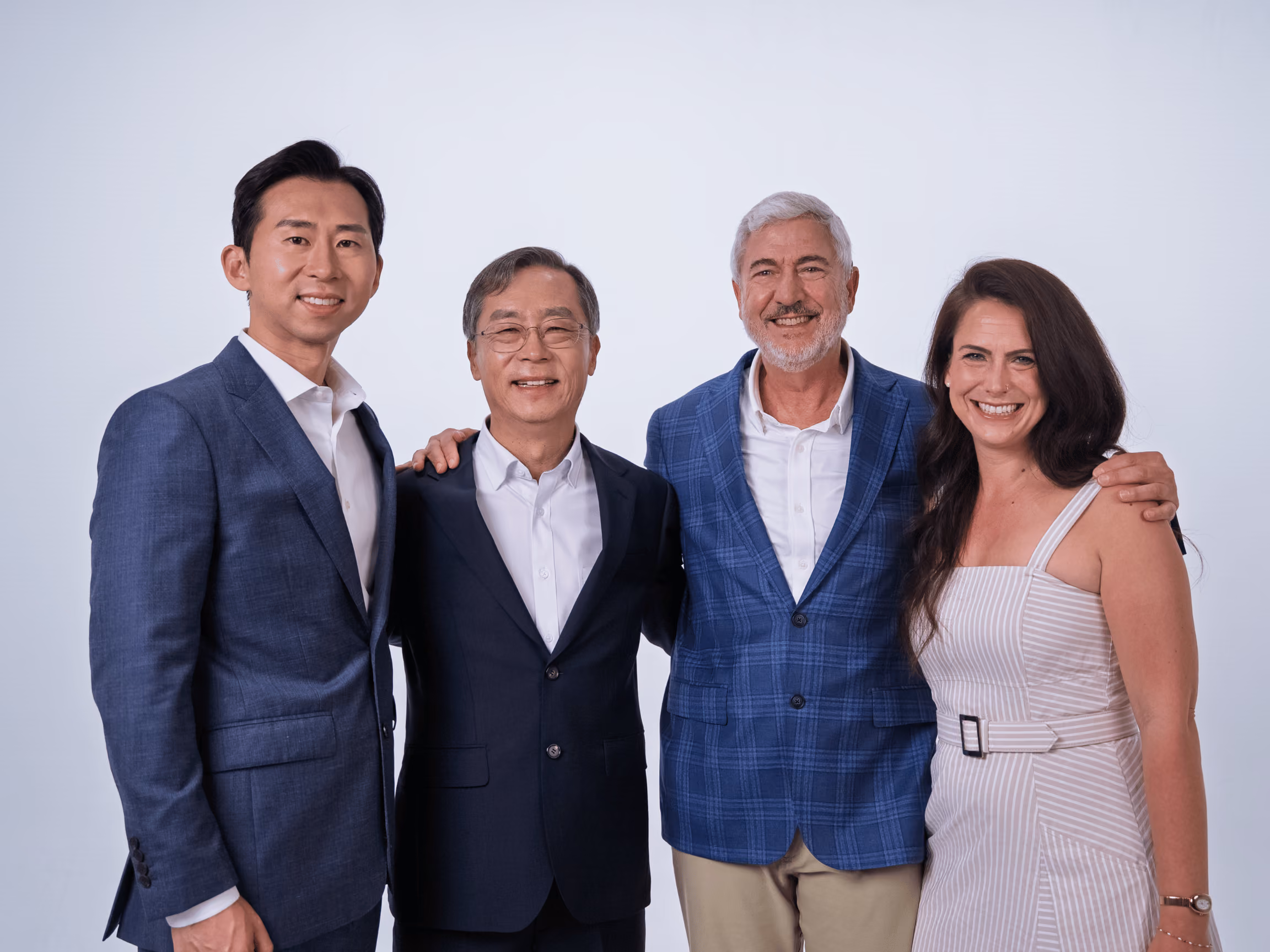 Four InnoCaption leaders stand together and smile for a portrait as the company prepares for its next chapter of leadership.
