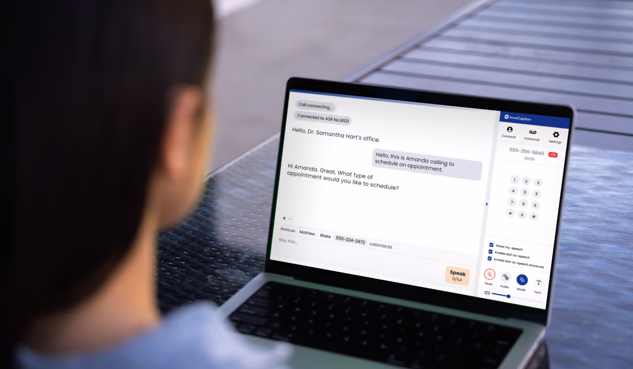 A woman uses InnoCaption Web on a laptop to make a captioned call to a doctor's office. The call transcript appears on the left side of the screen and a dial pad on the right.