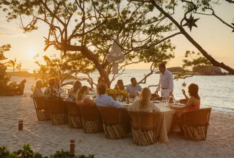 Beachfront dining at sunset