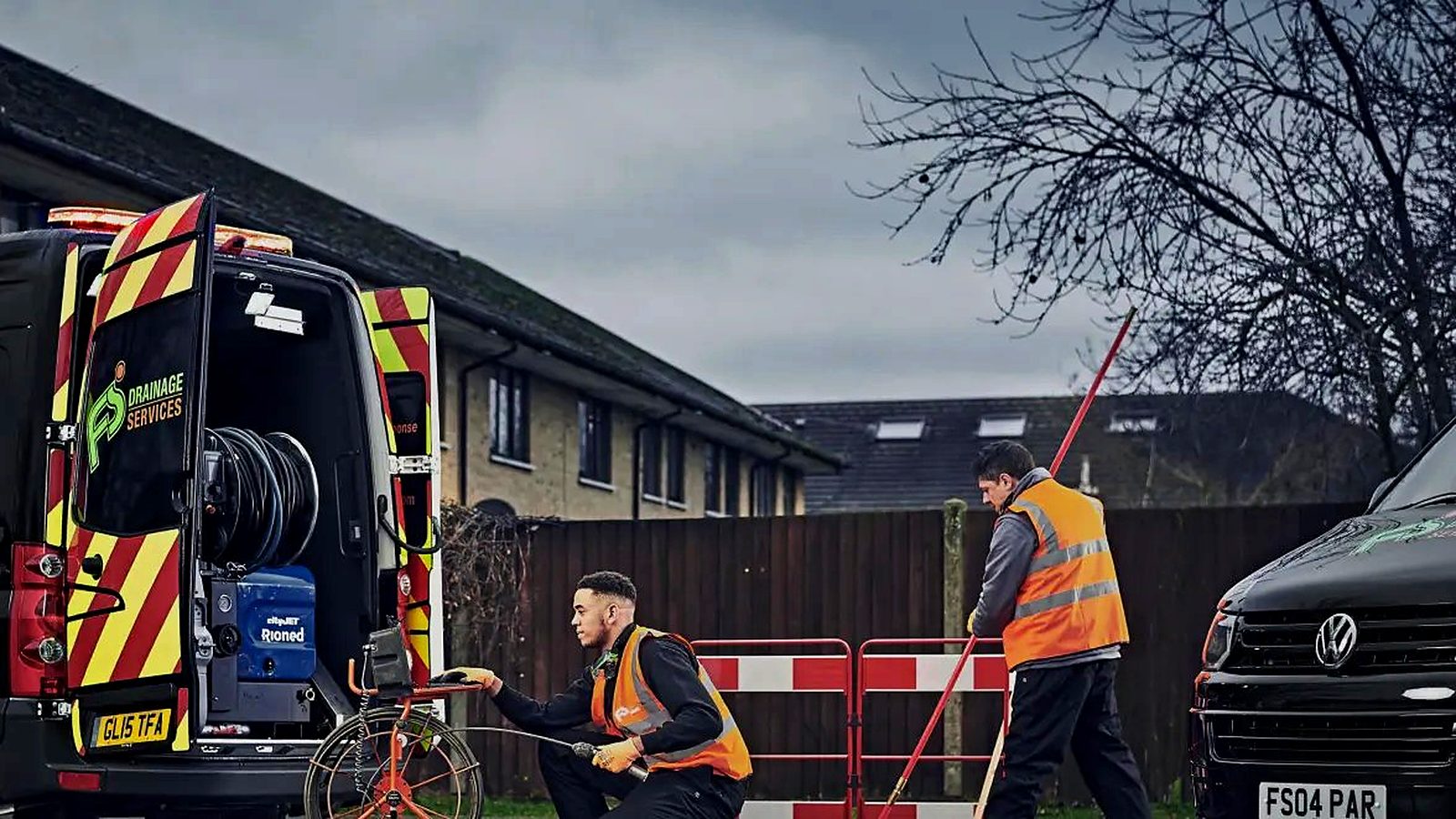 FS Group engineers clearing a drain with a camera reel beside the jetting van
