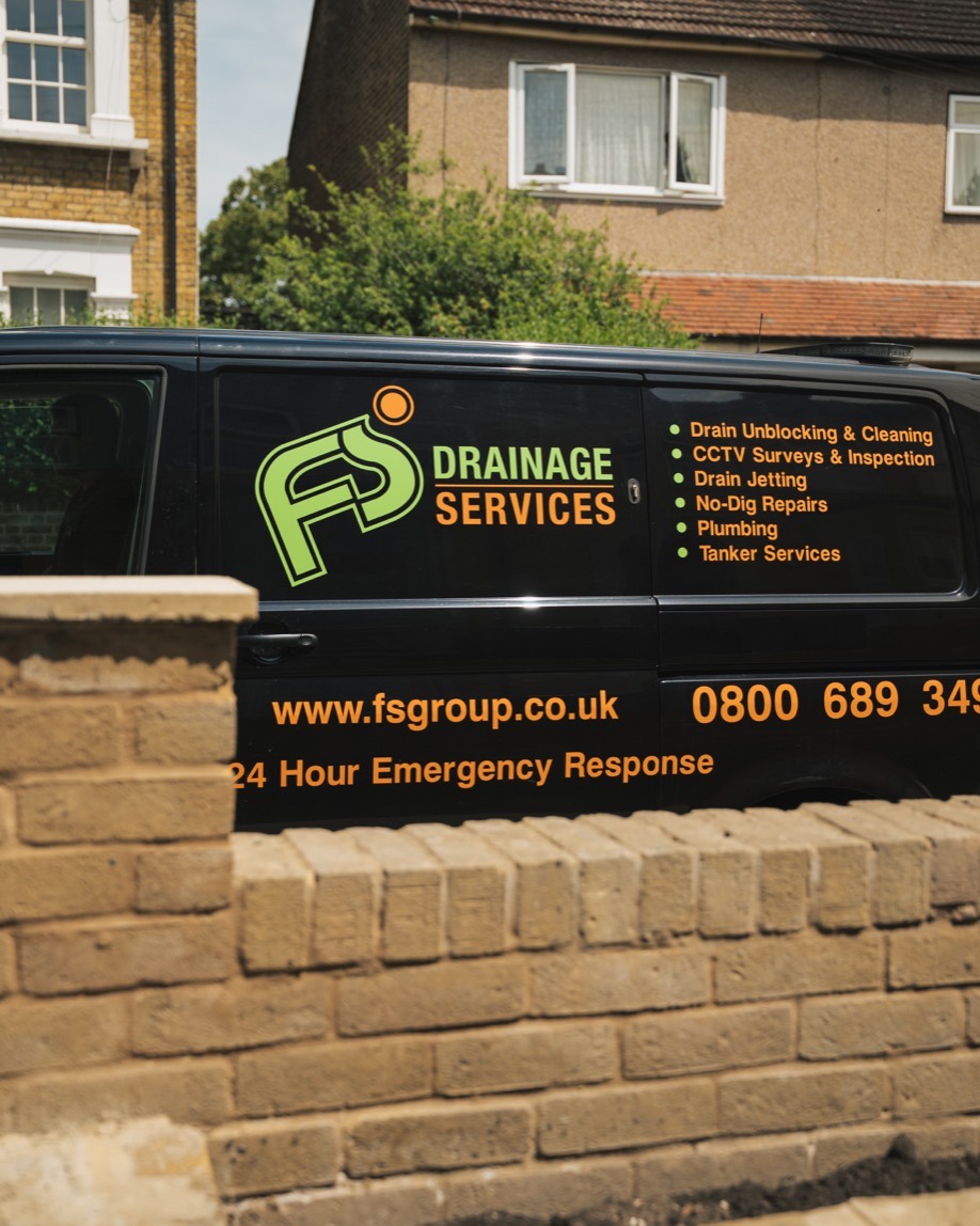 FS Group drainage van with the 24 hour emergency response number