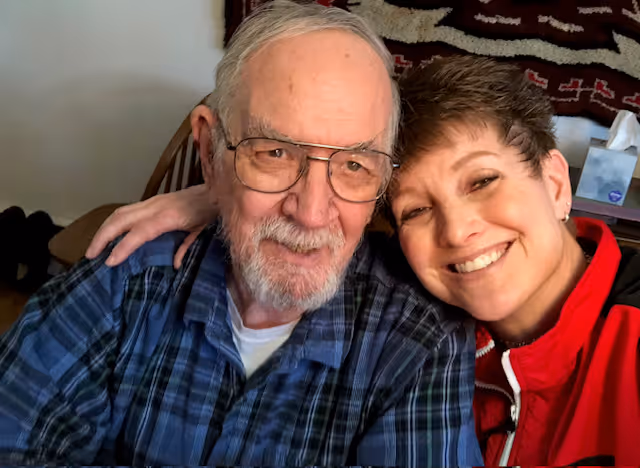 A man and a woman posing for a picture