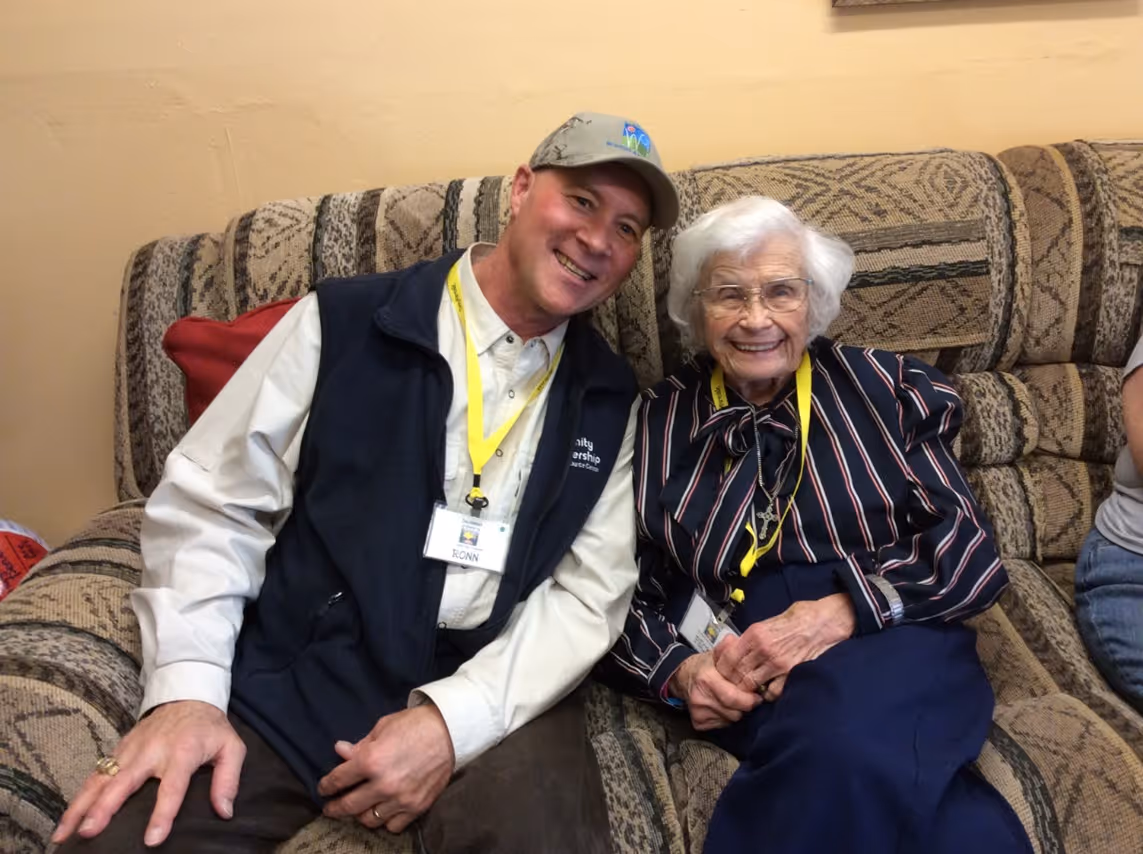 A man and a woman sitting on a couch