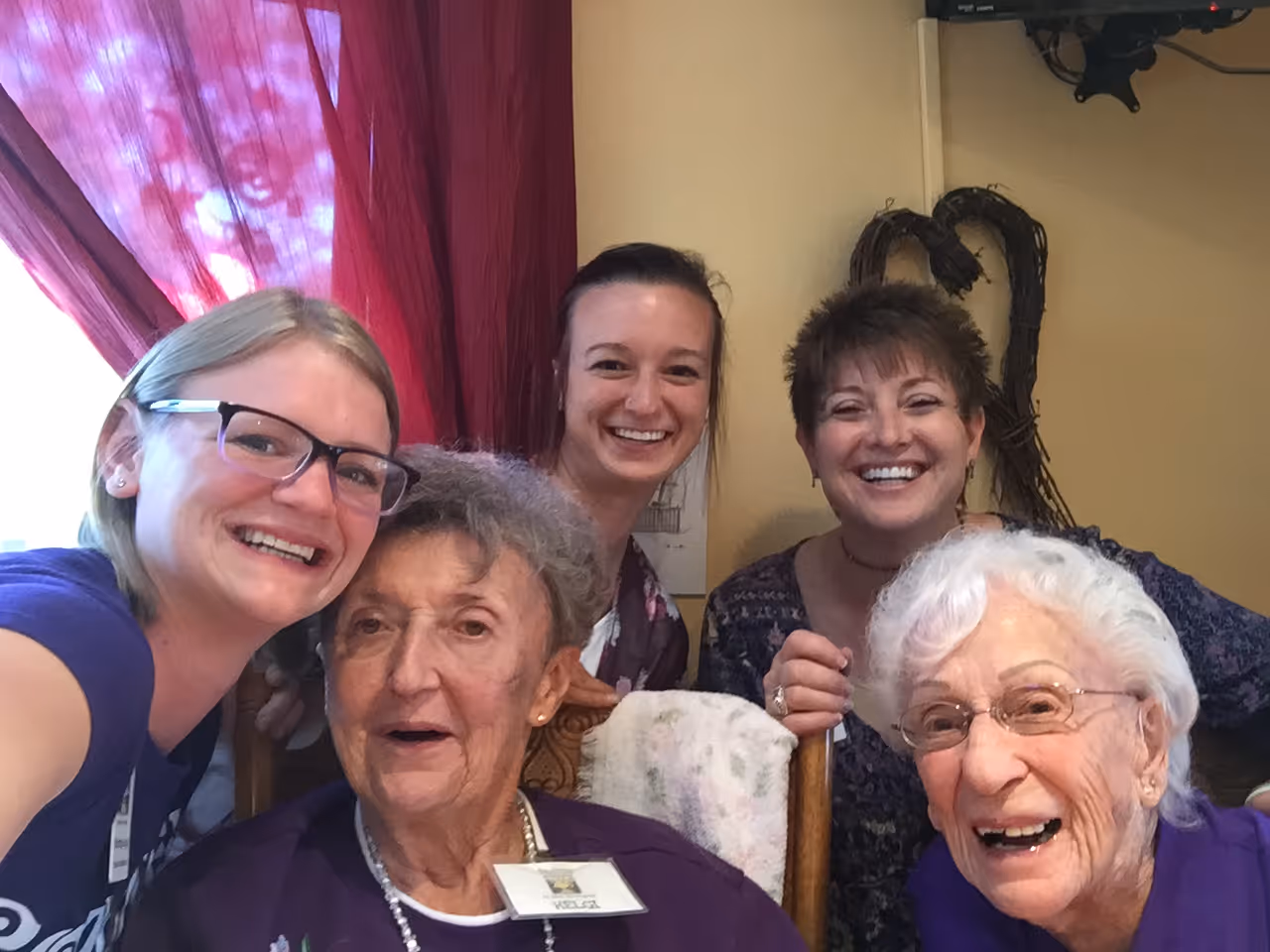 A group of older people standing next to each other