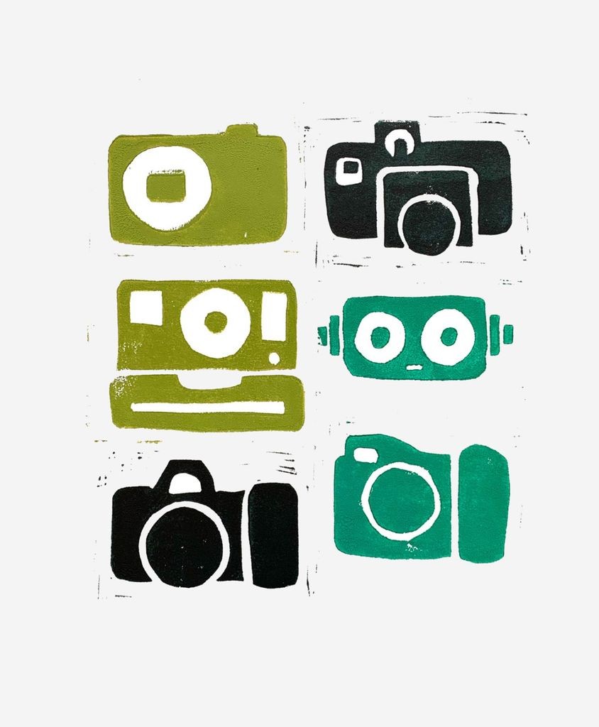 Linocut block print featuring five different retro cameras illustrated with simple shapes. Each camera is printed in a slightly different hue of green. The cameras are arranged in a 2 by 3 grid. The sixth position in the grid shows robot’s head standing in for one of the cameras. The robot head is drawn as a simple rectangle with large circles for eyes, a small mouth, and antenna pointing out of the side in place of ears. The linocut is printed on a white sheet of cotton paper.