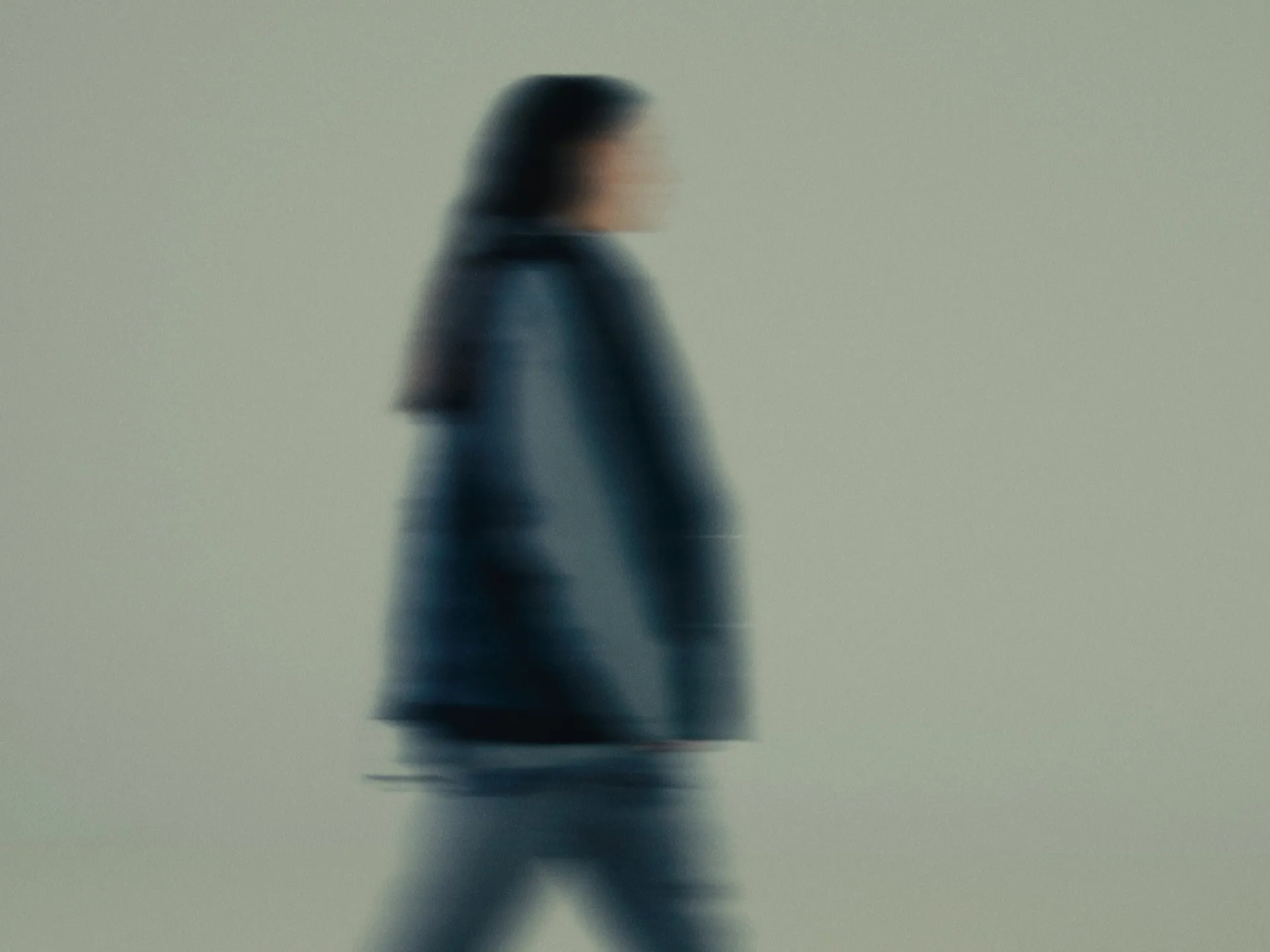 Woman is walking, image is blurred