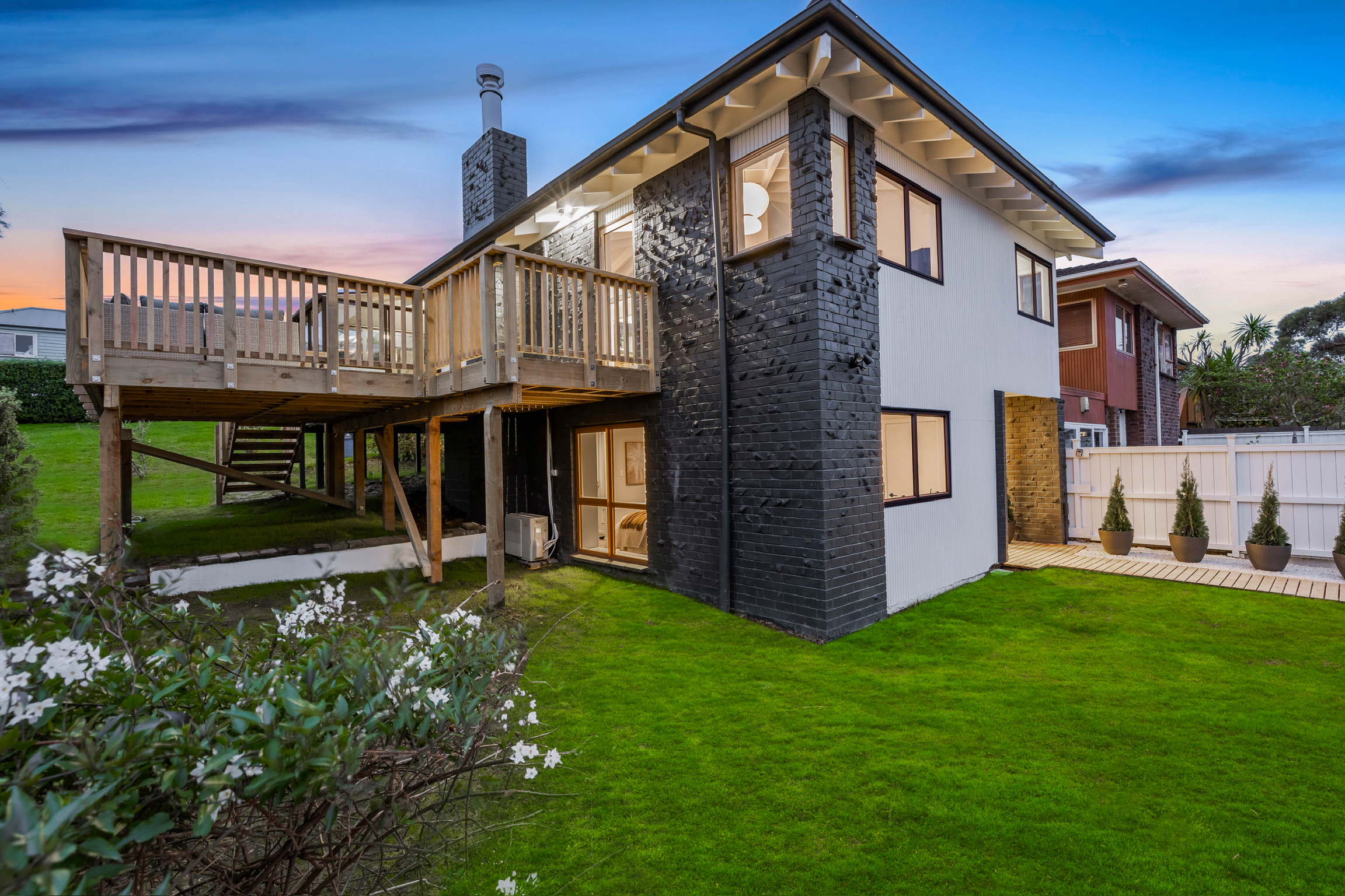 Image of a recent MTP Renovations project, with a sunny deck, showing the promise of summer entertaining at home.
