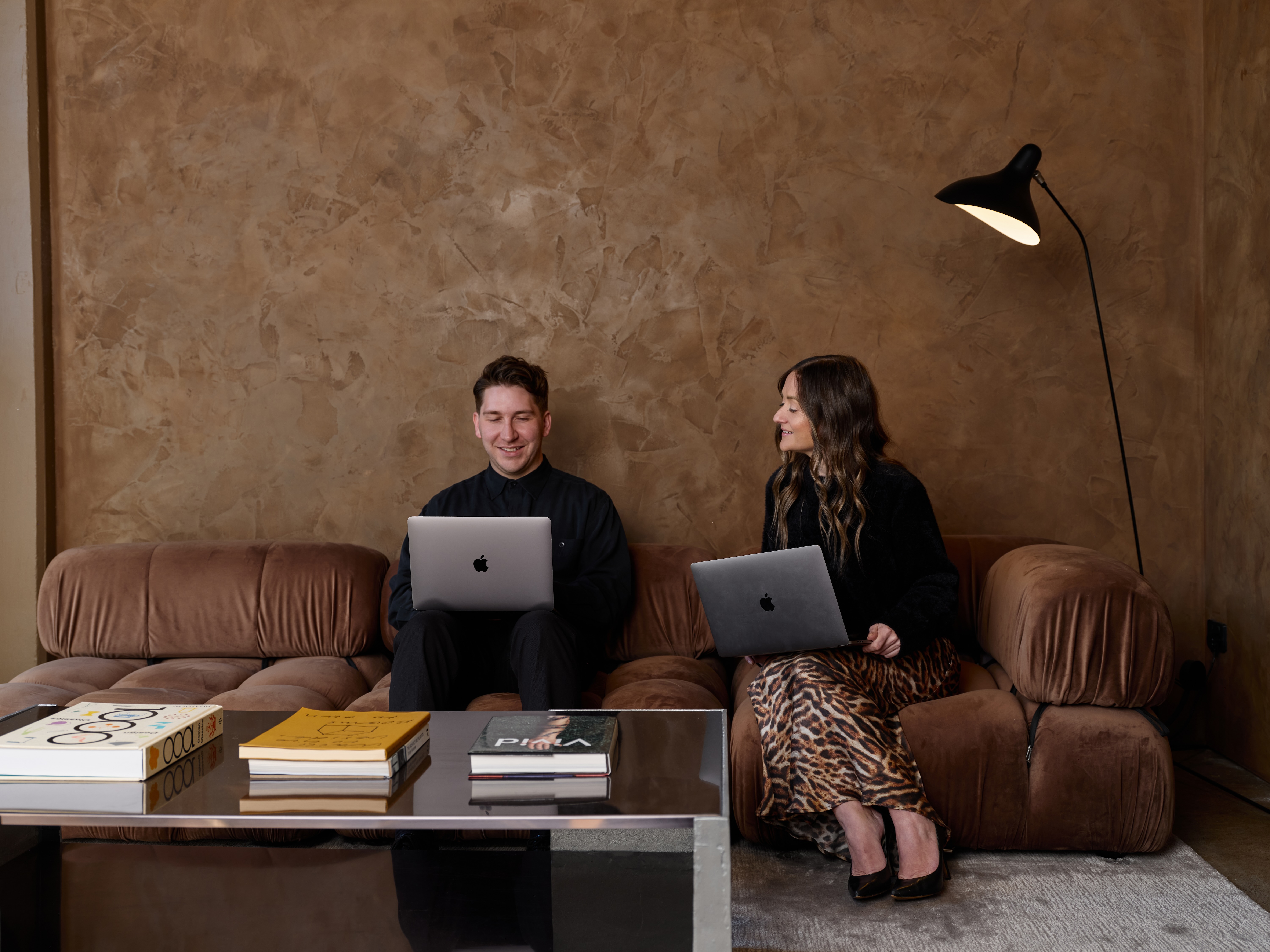 Power house agency team brainstorming at a table