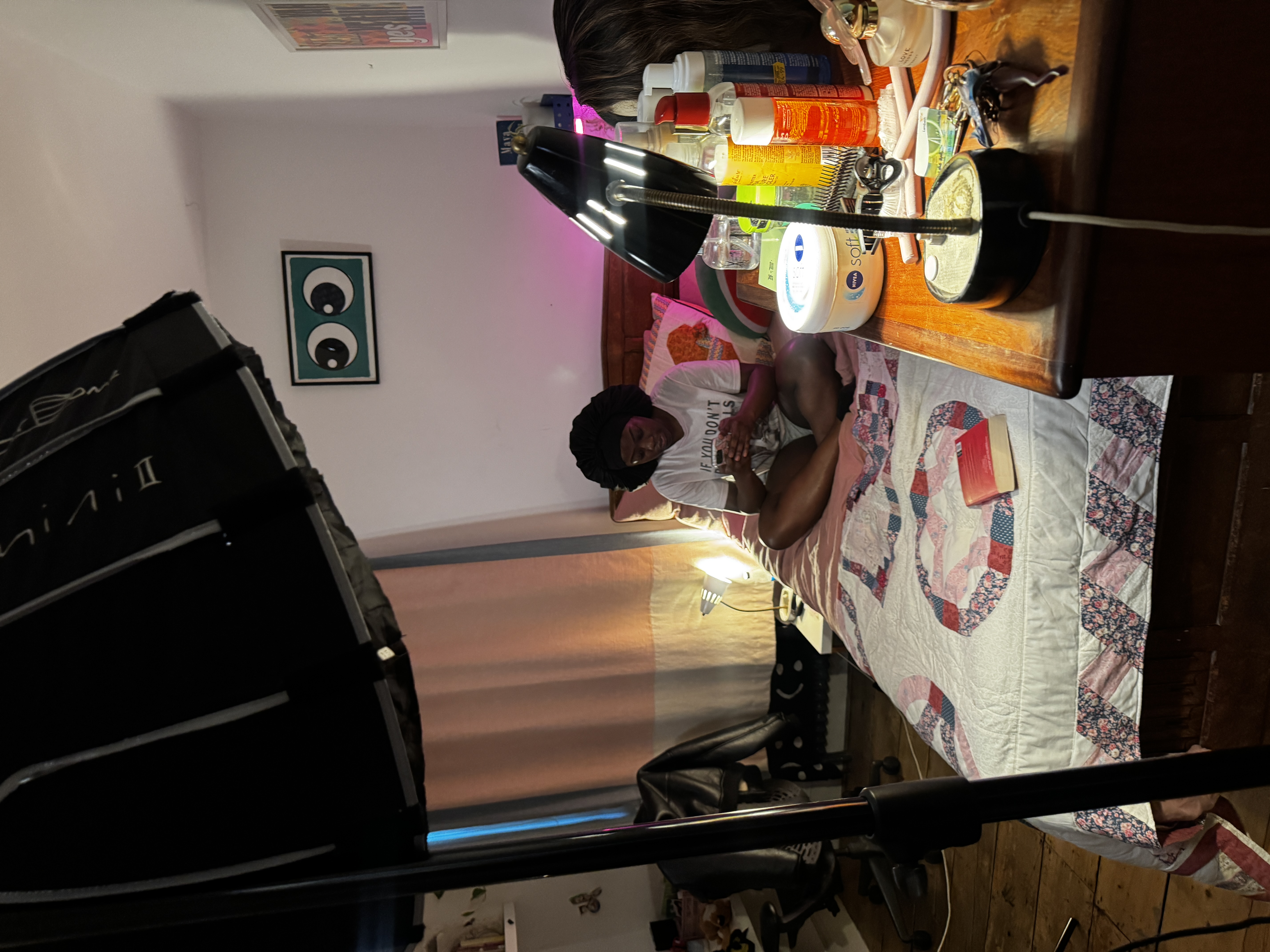 A photograph of a bedroom showcasing Black beauty hair products.