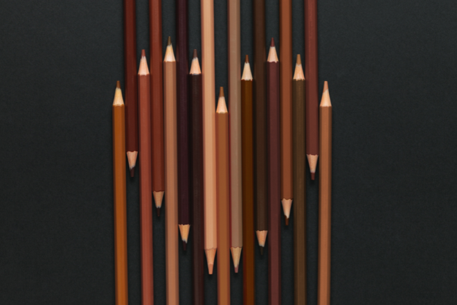 Photo of different shades of brown colour pencils with the lighter tips making a heart shape - Source Canva Pro