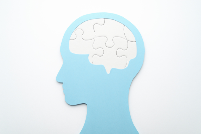 Graphic showing a head profile with a brain depicted as connected puzzle pieces, symbolising thinking or mental processes. - Image credit Canva