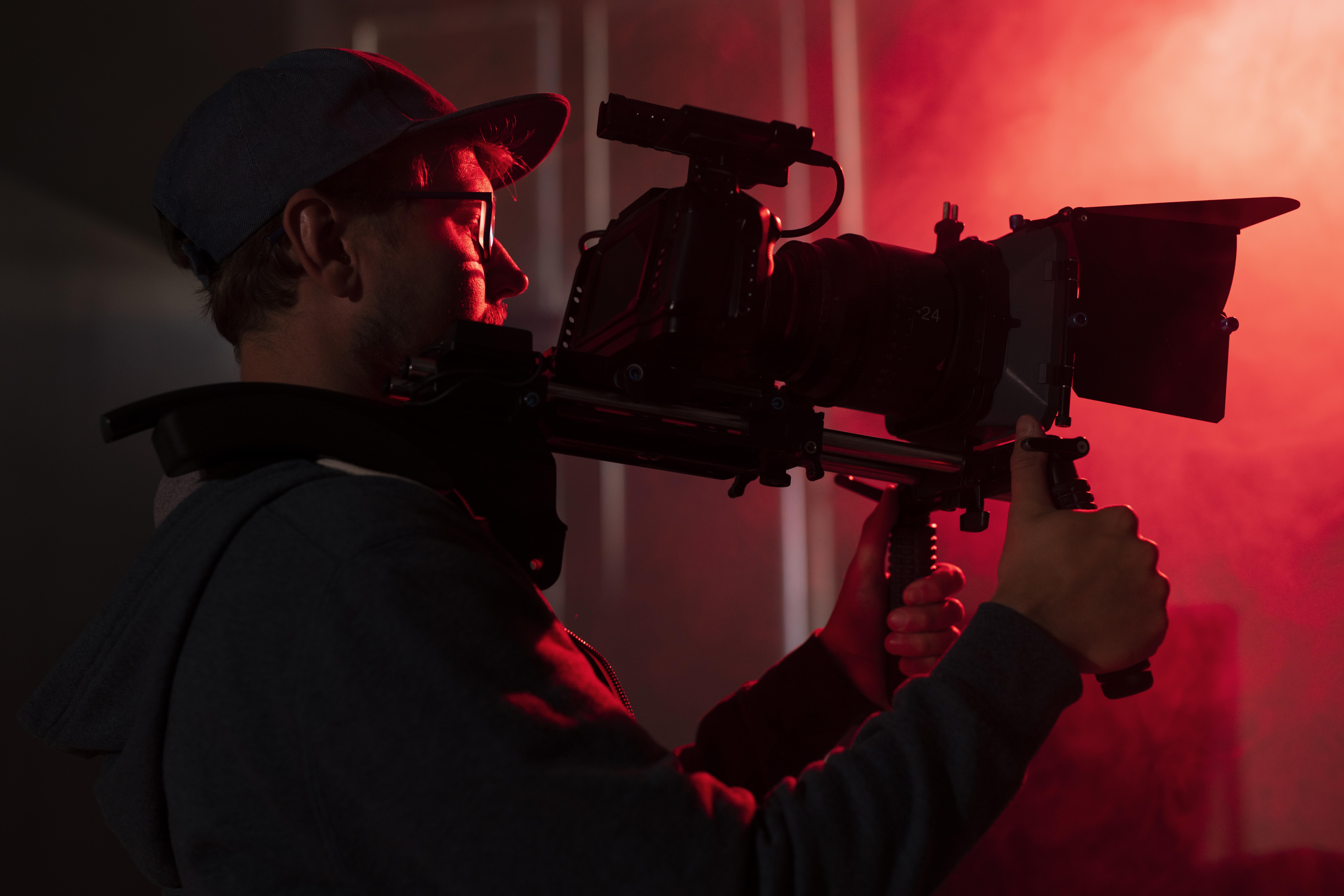 Man with a camera rig.
