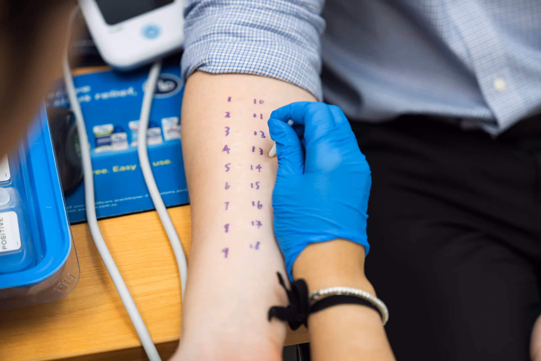 Assistant during a treatment allergy testing procedure