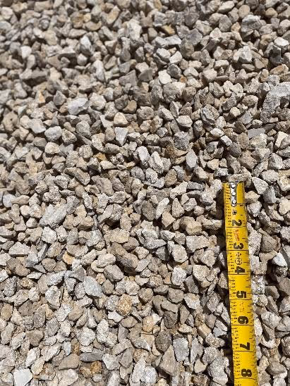 Close-up of limestone gravel used in concrete mix, an essential material for preventing Alkali-Silica Reaction (ASR) due to its lower reactivity compared to other aggregates.