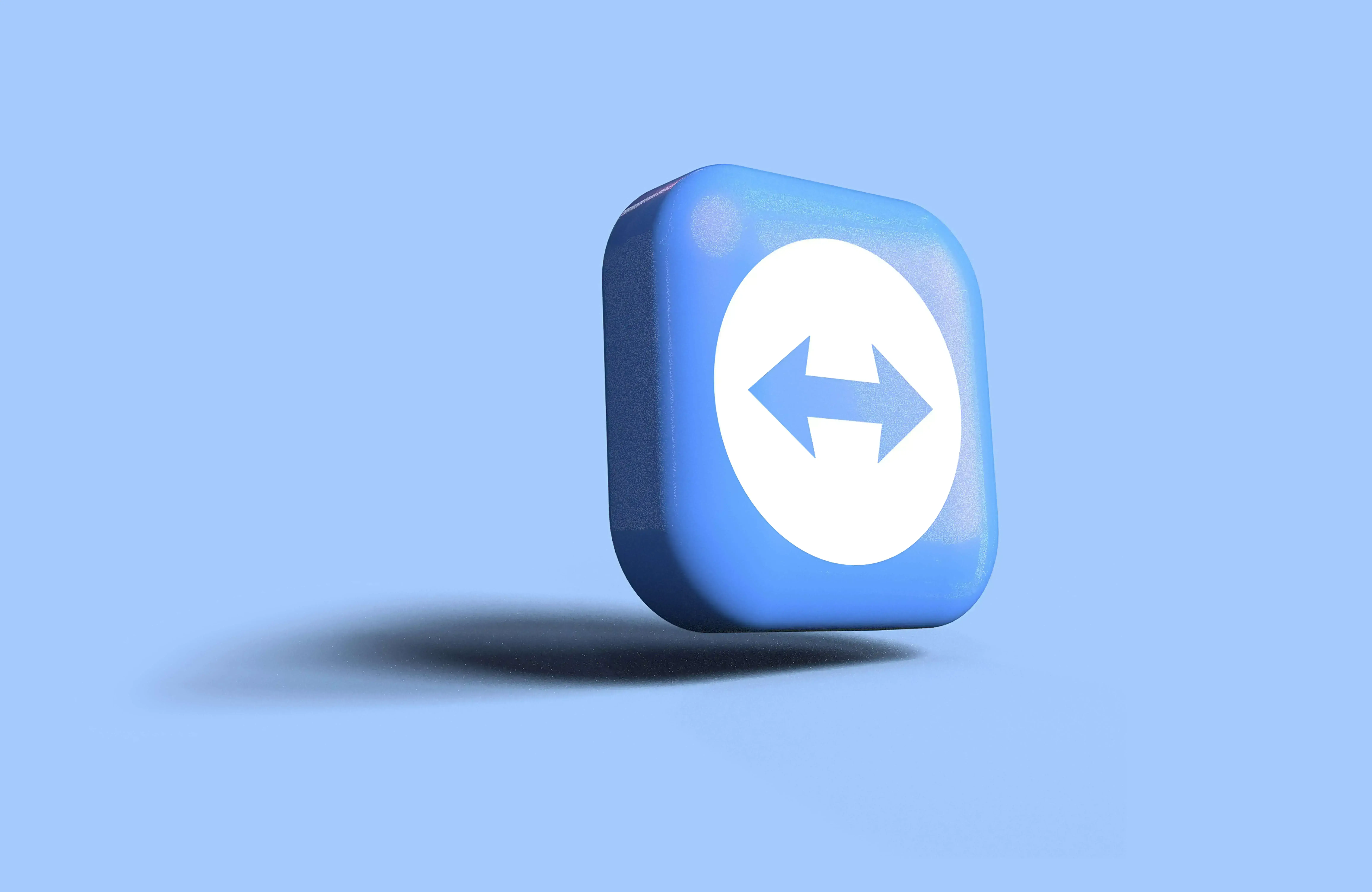 A floating blue square icon with rounded edges, featuring a white circle in the center.