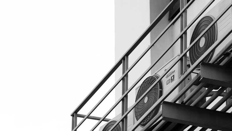 Air conditioner condenser units mounted on a building exterior