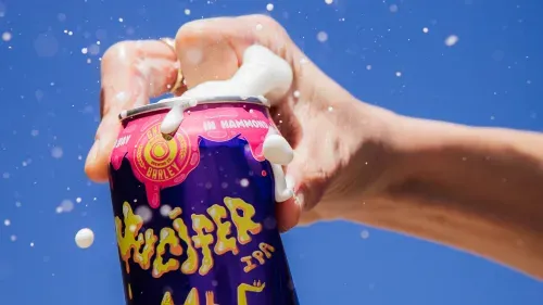 Close-up photos of the a Jucifer can being opened and overflowing
