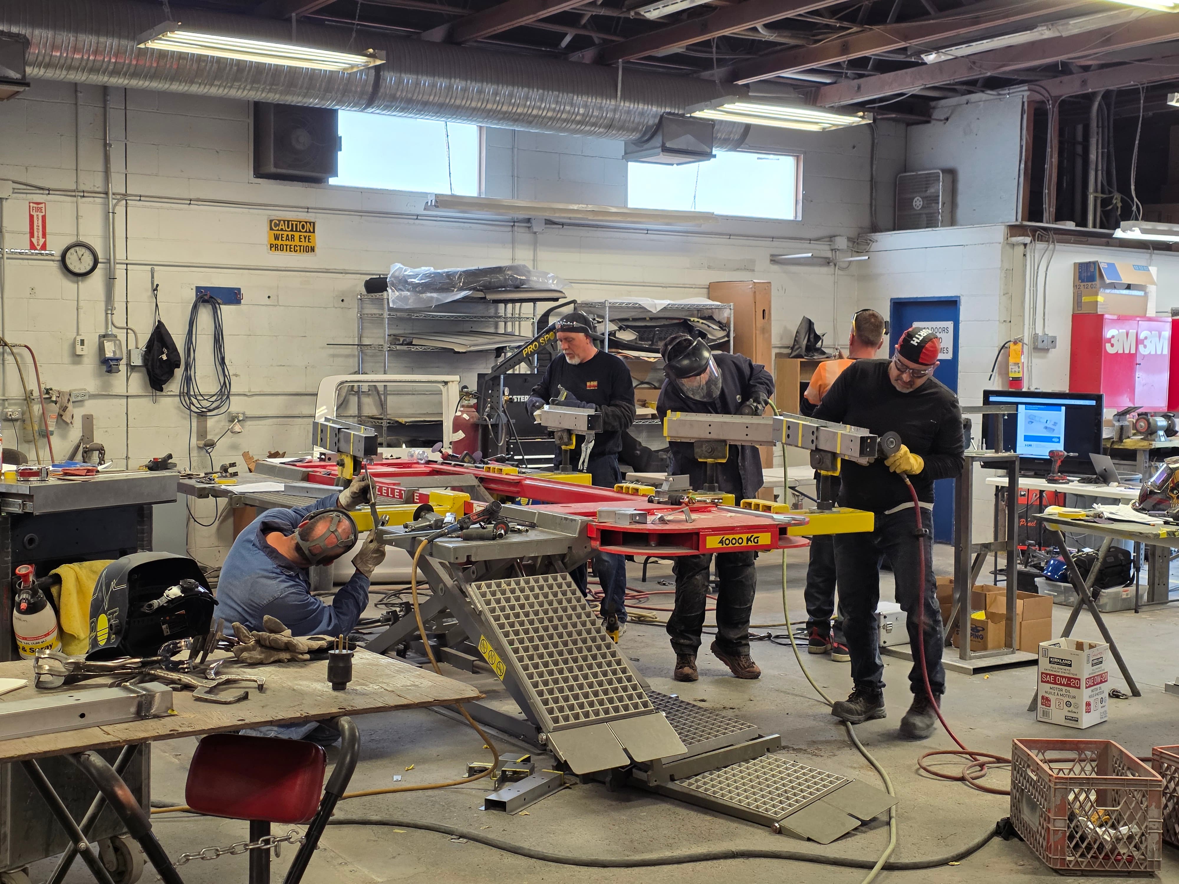 mechanic hands repairing under the hood of car