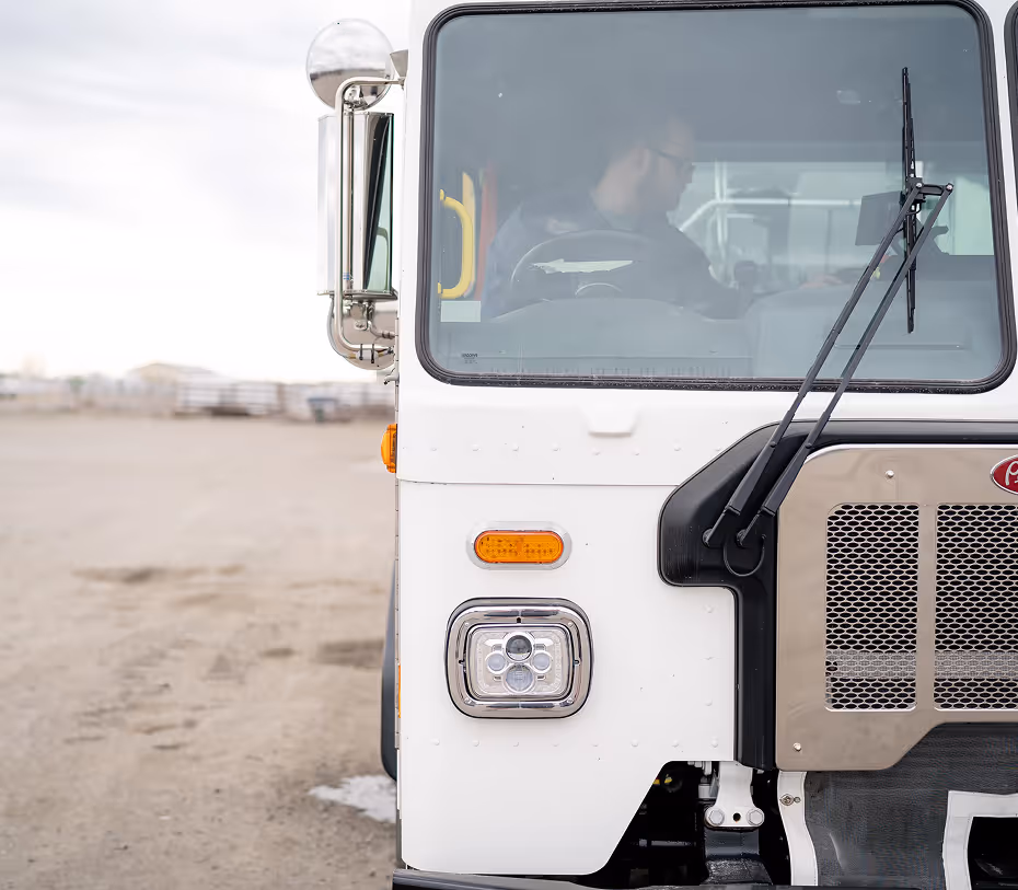 Sanitary Disposal residential trash truck servicing Hermiston neighborhoods with reliable pickup service