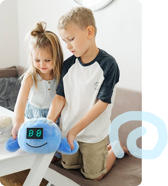 Two children playing with the Jio plush companion
