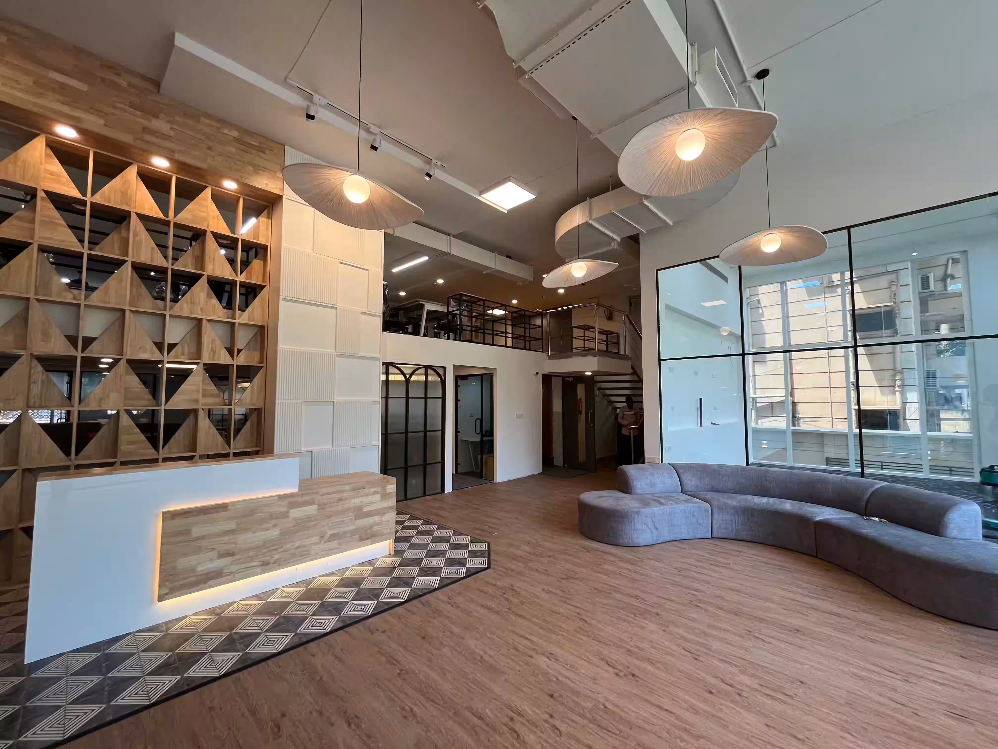 reception area of office space with modular sofa and lighting 