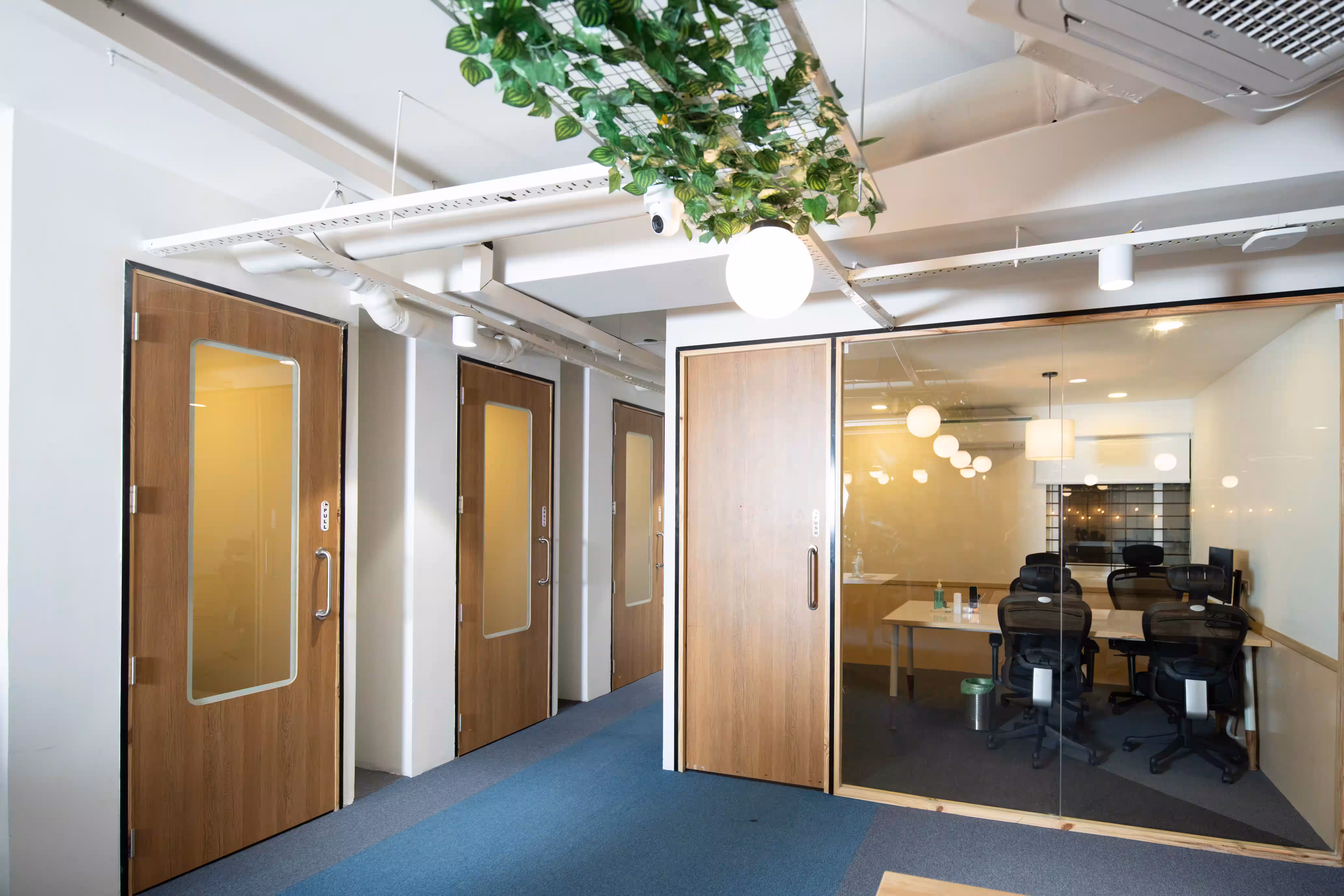 Urban Vault corridor with greenery and meeting rooms