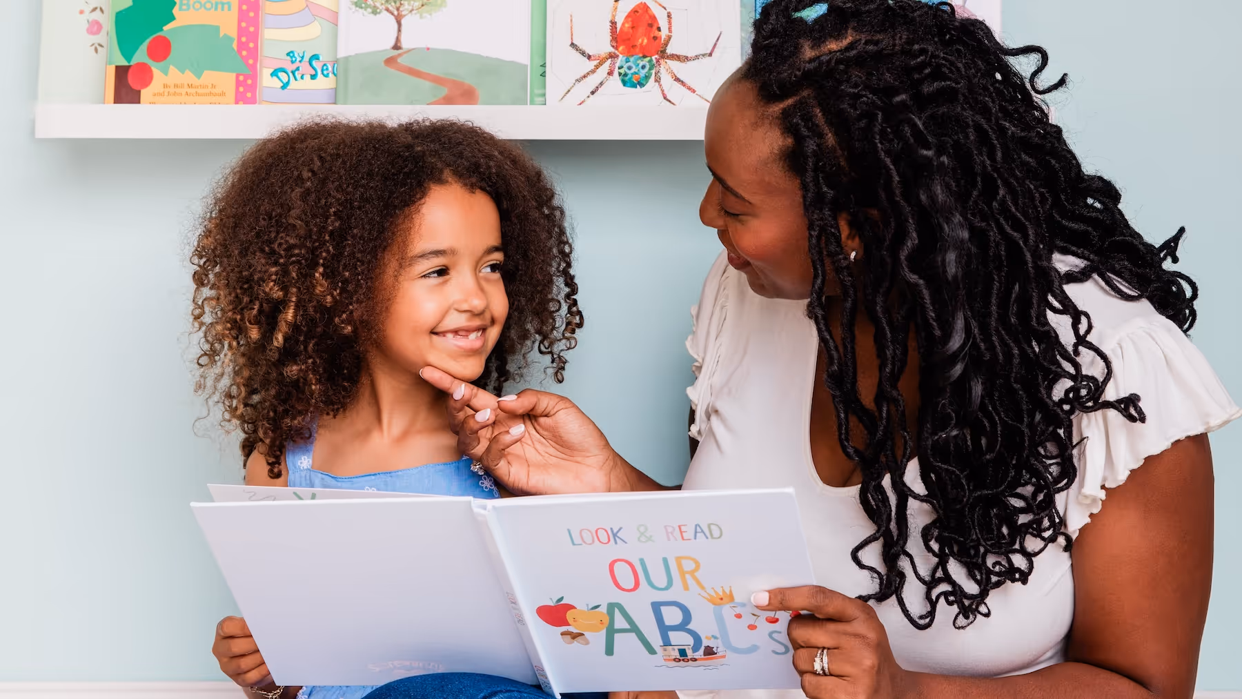 Mother and Daughter Reading Stareworthy Book