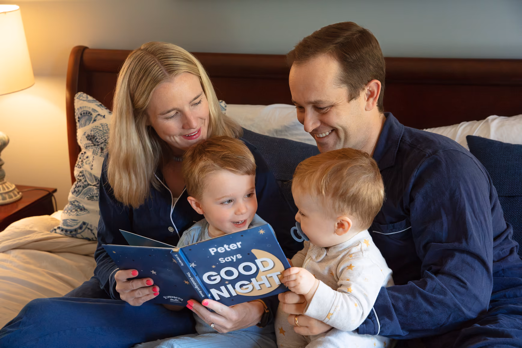 A mother reads her Stareworthy ABC Book to her baby son