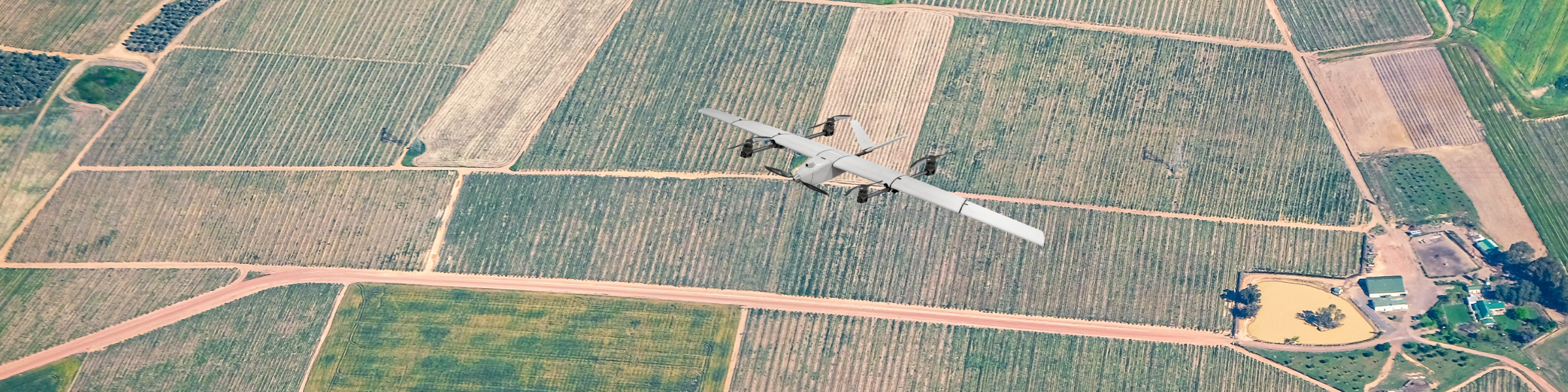 xRAID VTOL flying over farm fields