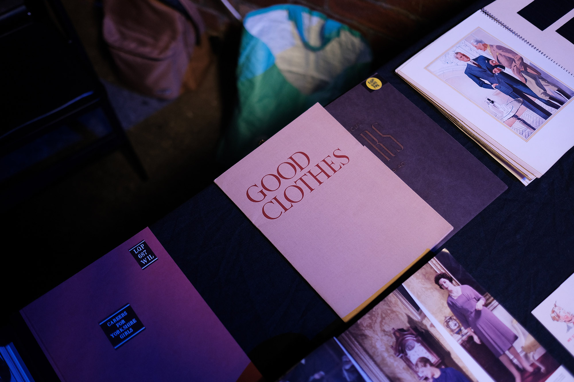 A table displaying a selection of printed flyers and magazines.
