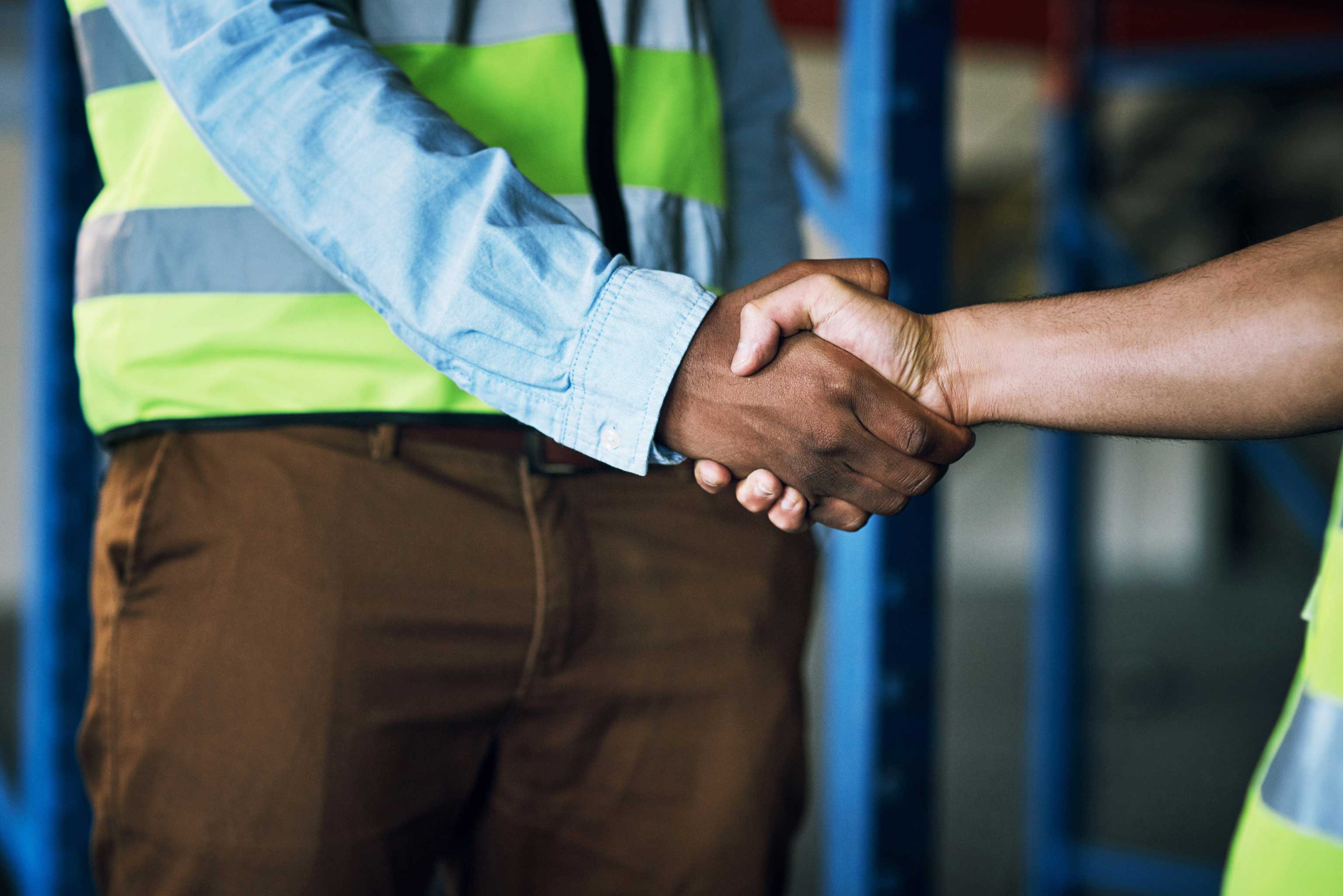 Cropped image of two people shaking hands