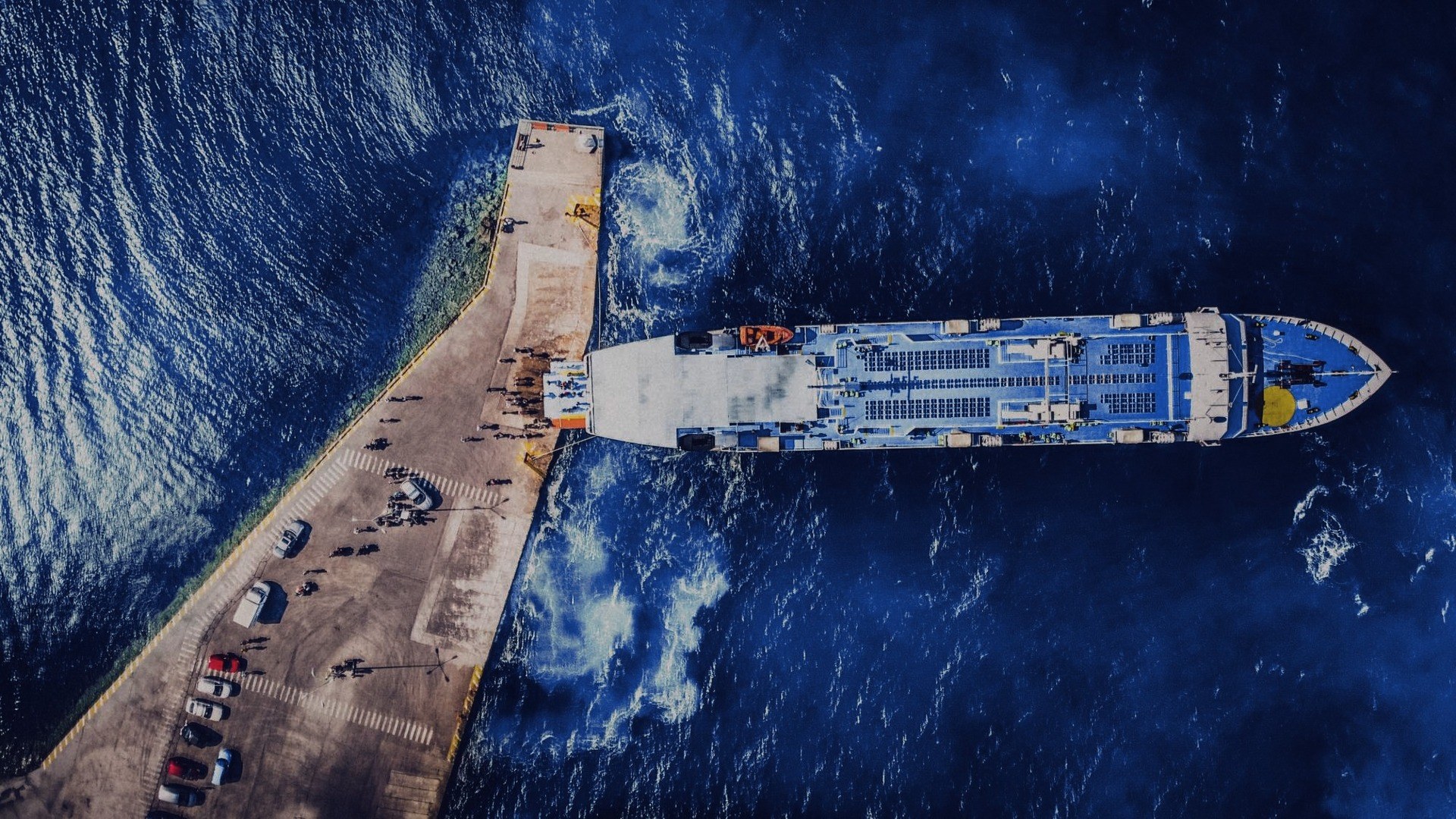 Aerial view of a passenger ferry docked at a pier