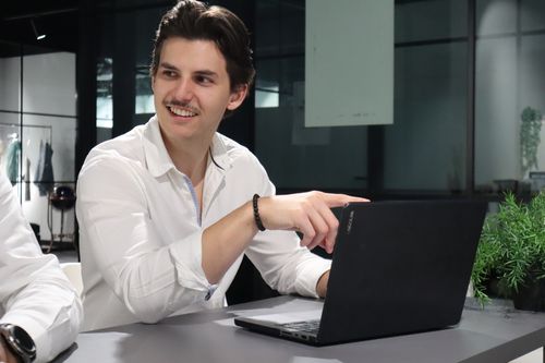 Phillipe Adamtchek, founder of Novicate, working in an office environment.