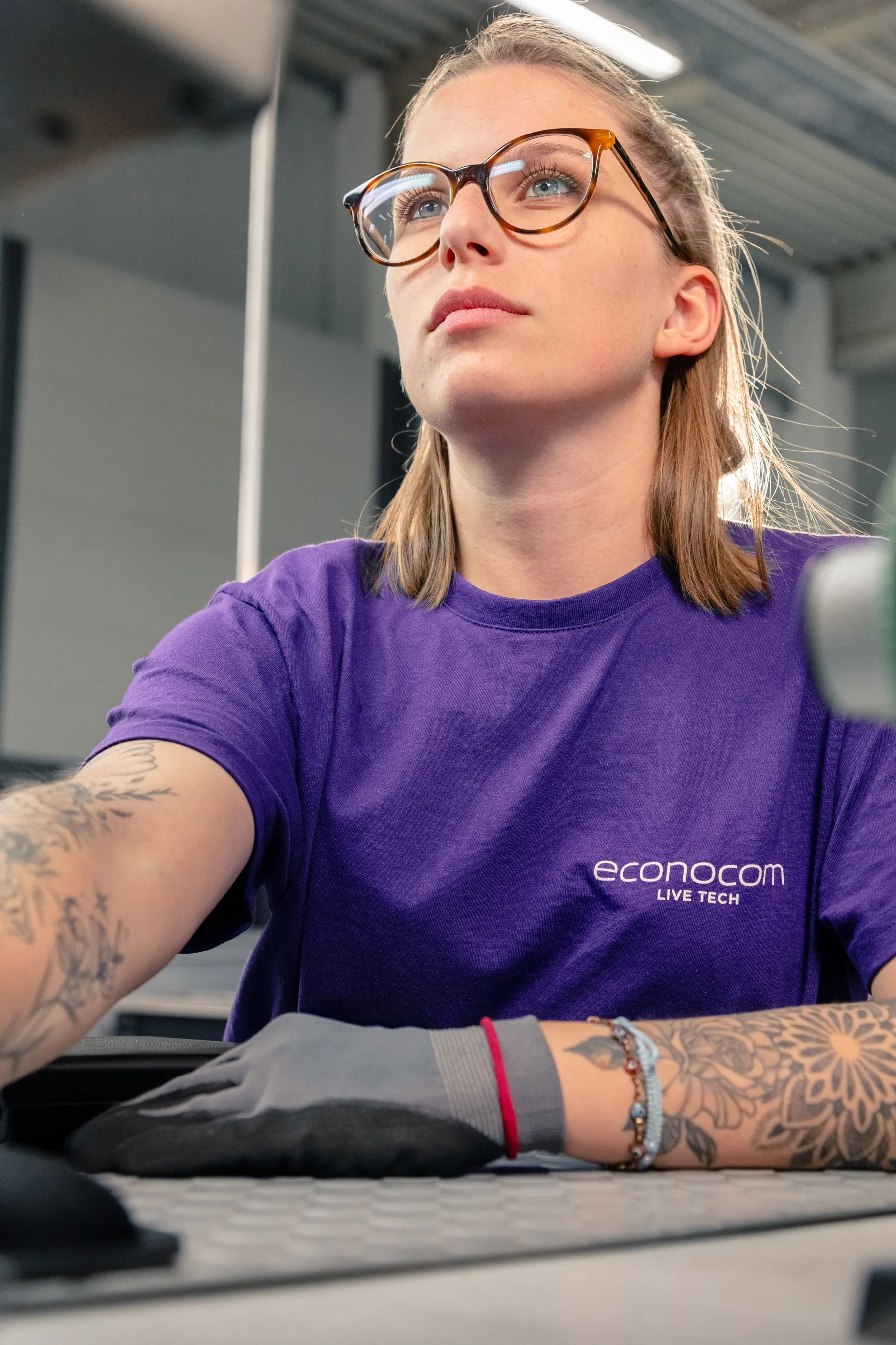 An employee is sitting at her workplace.