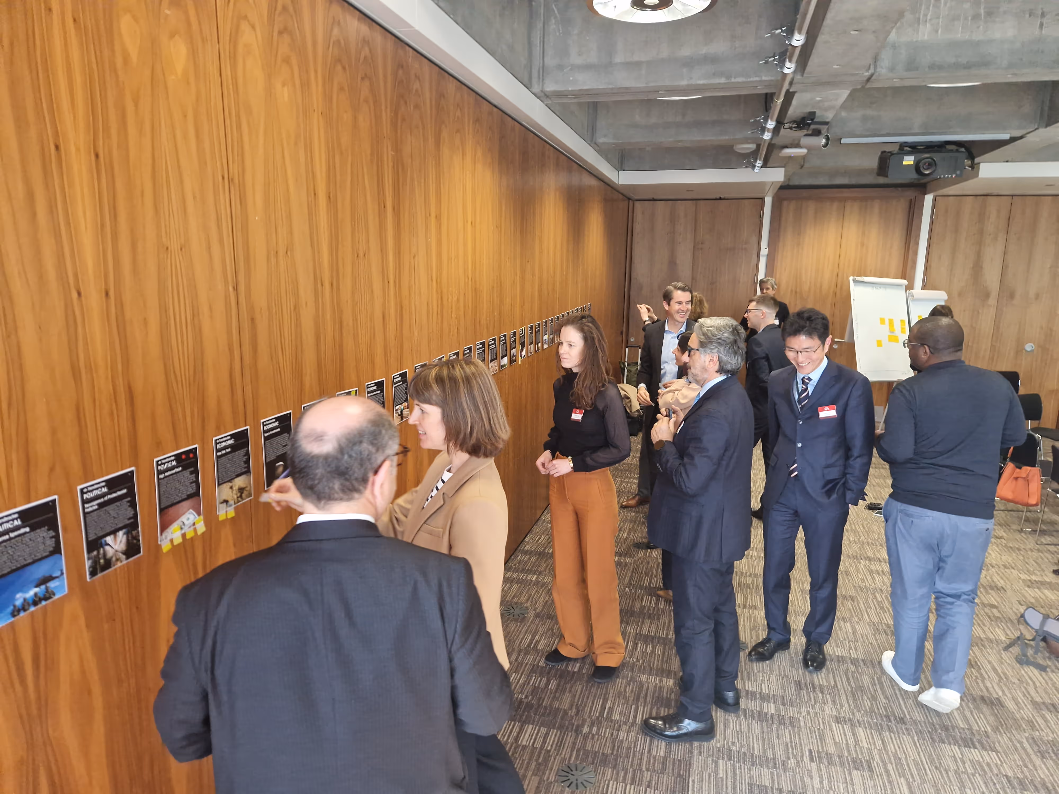 Insurance strategy workshop with Geneva Association members analyzing AI-prioritized blind spots using foresight tools.