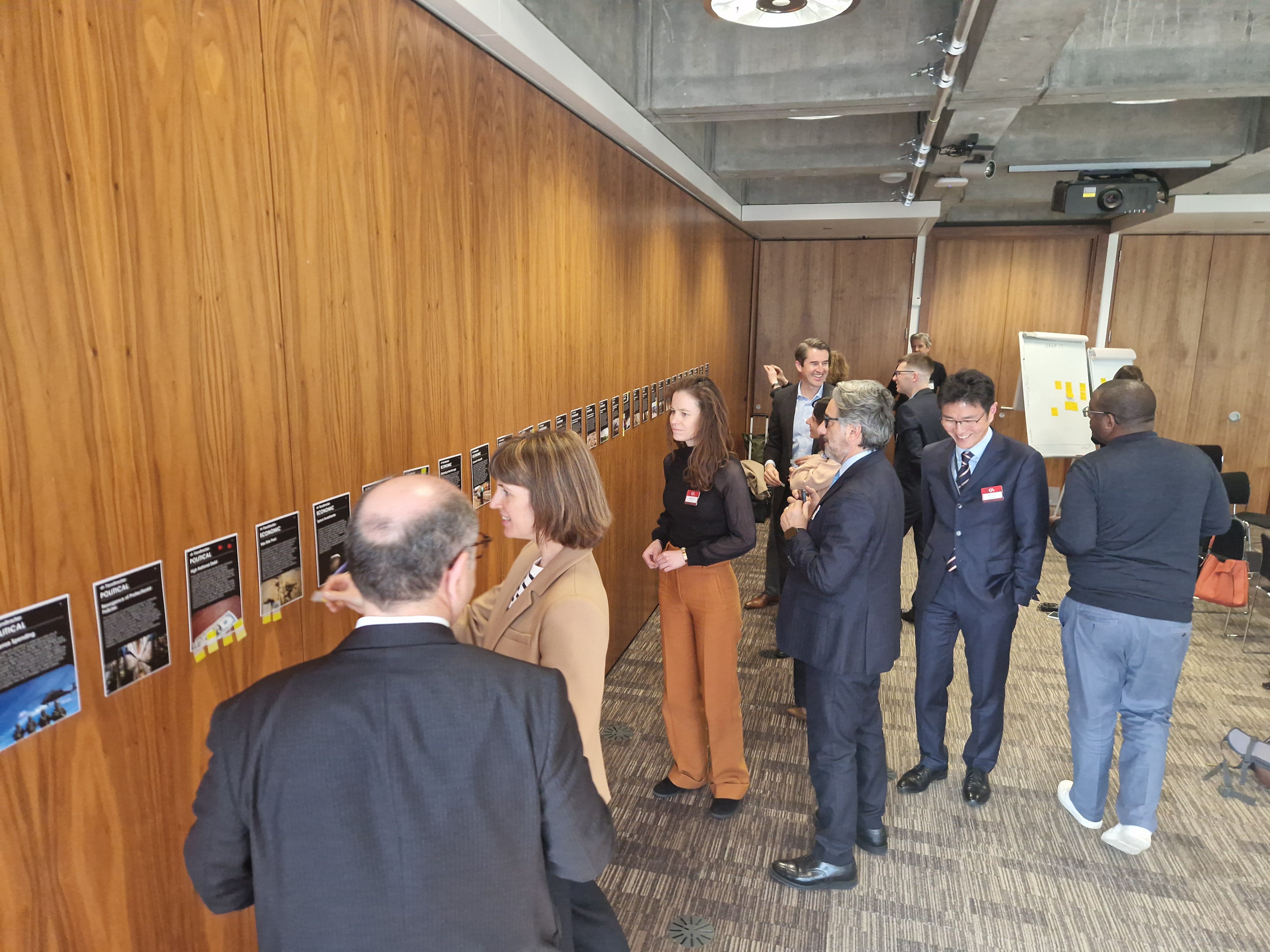 Insurance strategy workshop with Geneva Association members analyzing AI-prioritized blind spots using foresight tools.