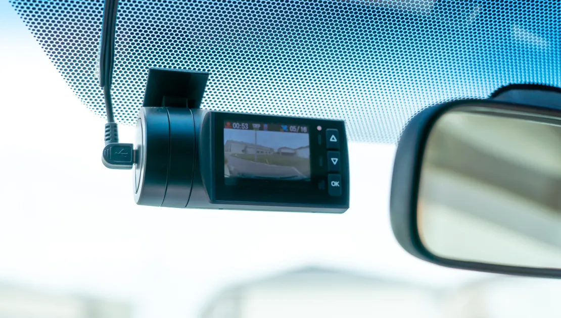 Image shows a dashcam inside a car