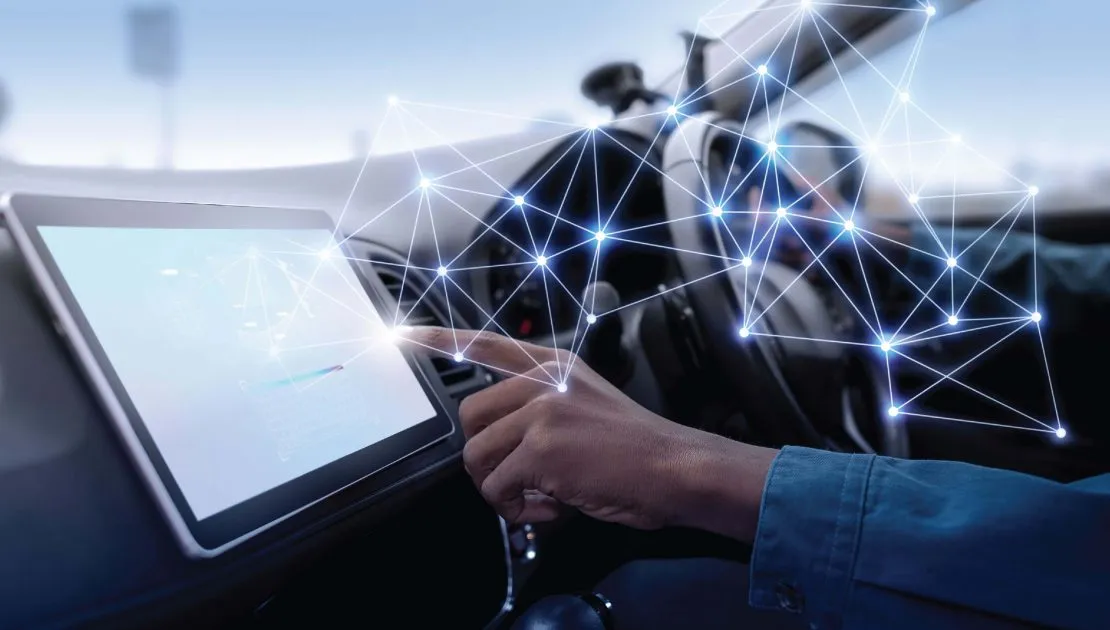 A driver using the console in his car