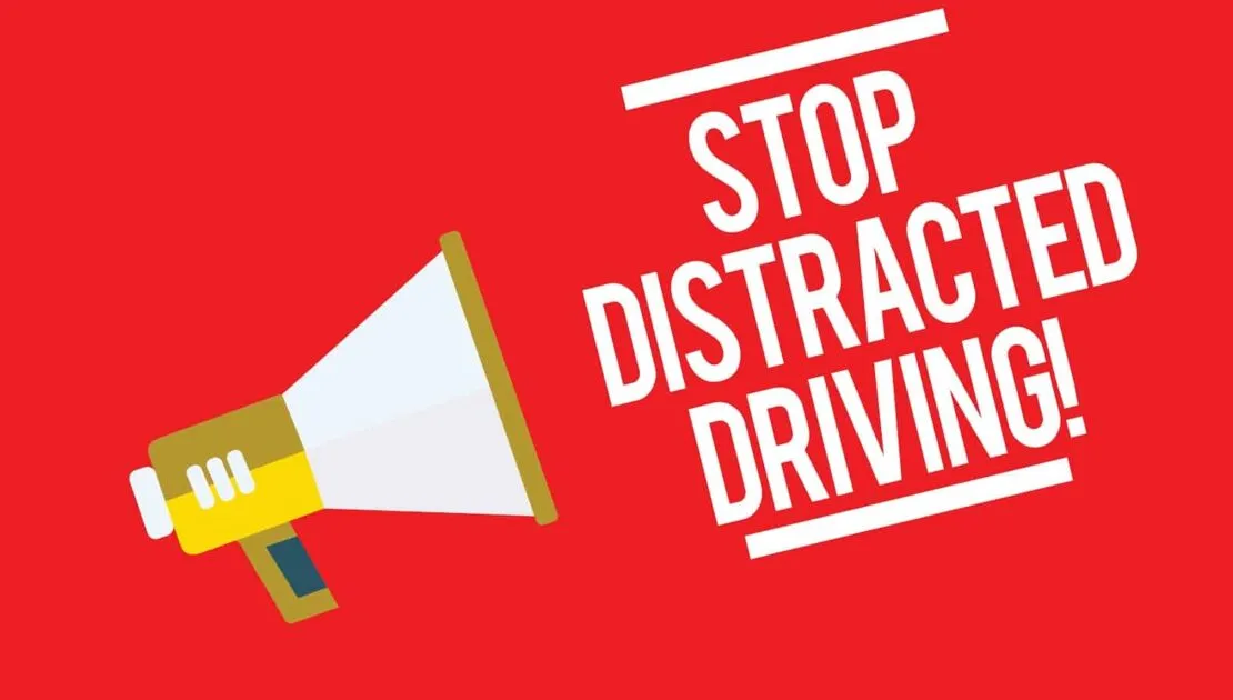 An image with the writing "stop distracted driving"