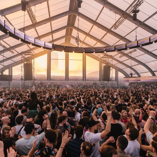 DGTL crowd beneath an indoor stage roof