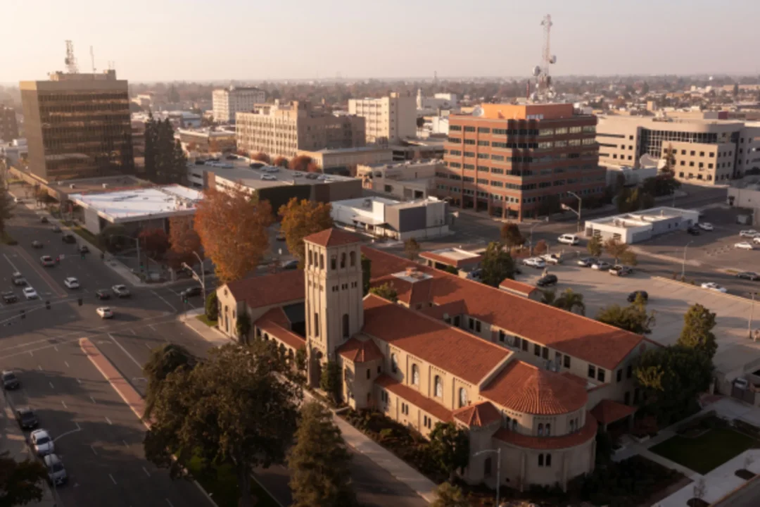 Aerial view of downtown with historic church and modern office buildings