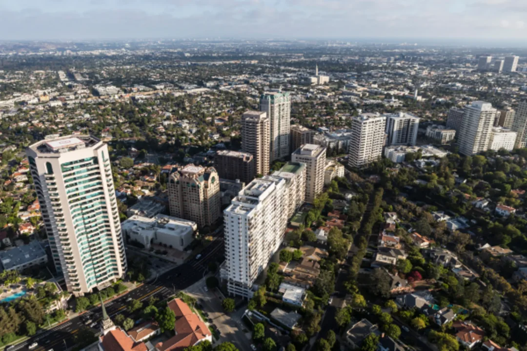 Aerial view of urban landscape with high-rise buildings and residential neighborhoods