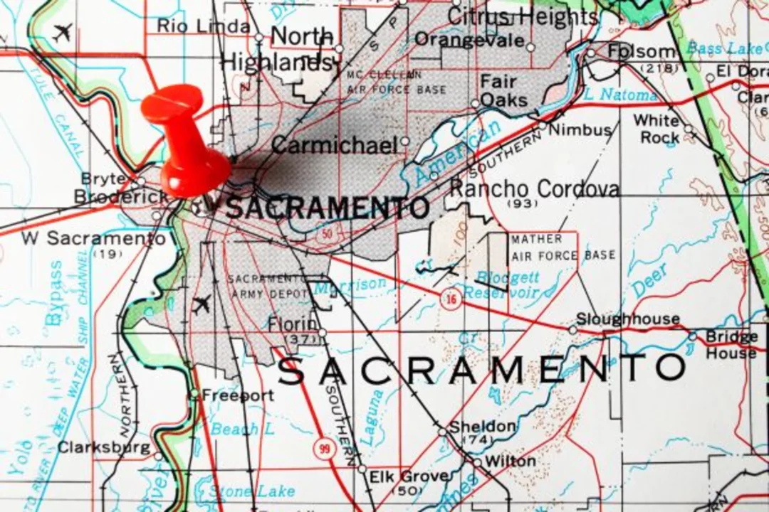 A red pushpin marks Sacramento on a detailed road map showing the California capital and surrounding areas including North Highlands, Rancho Cordova, and nearby cities.