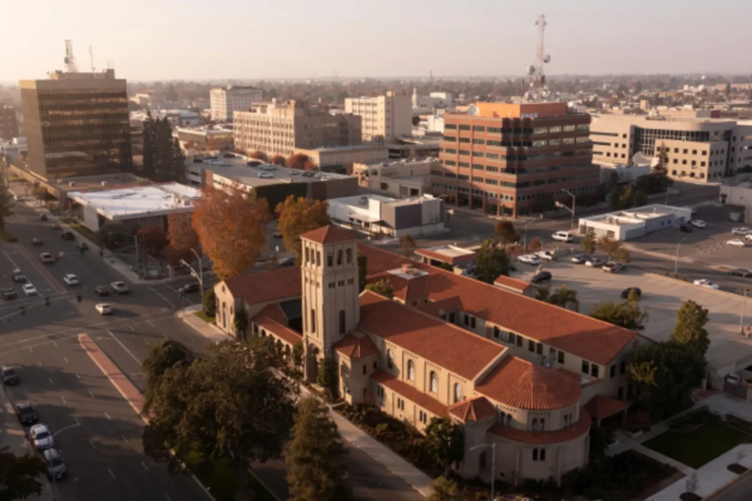 Aerial view of downtown with historic church and modern office buildings