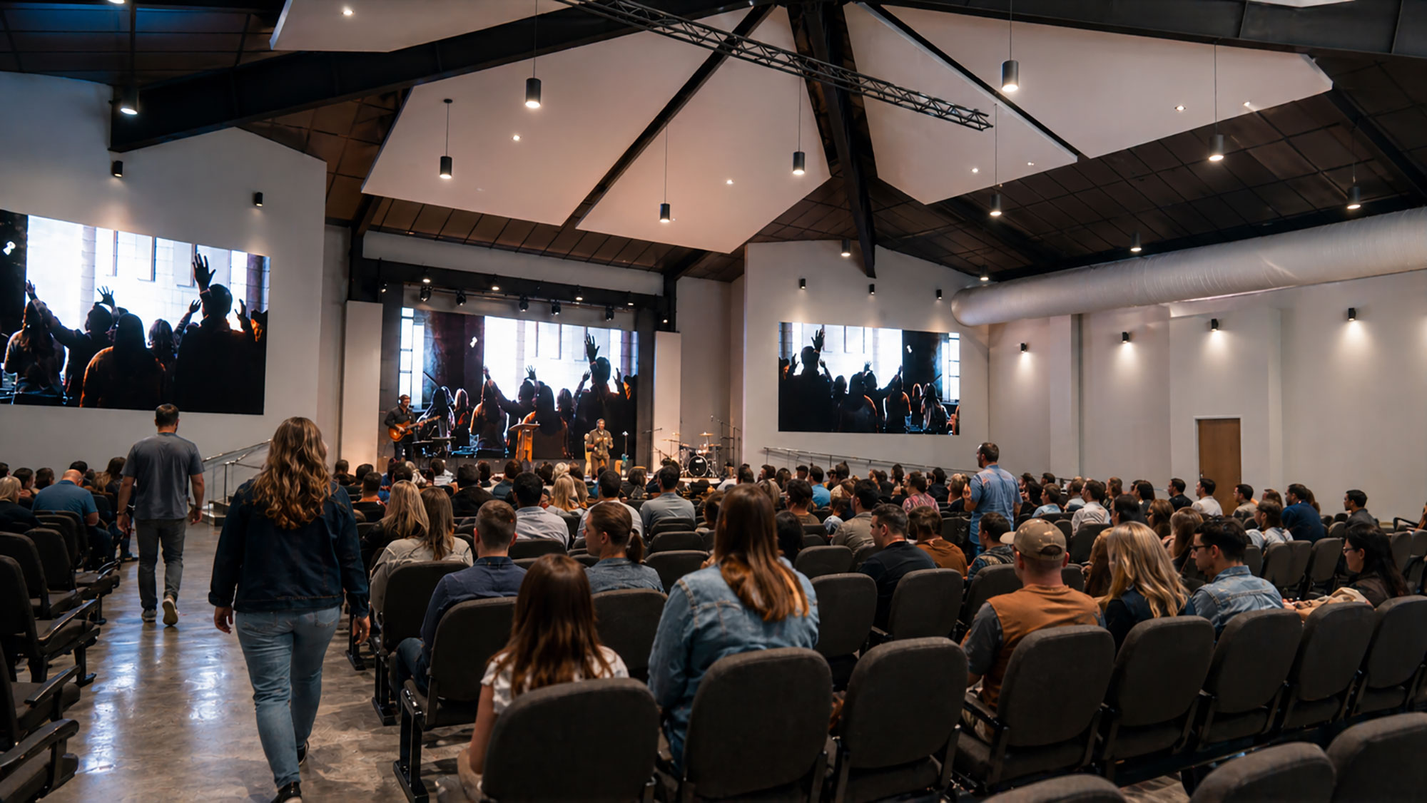 Modern church interior designed by Ossa Studio featuring contemporary worship architecture and stage lighting